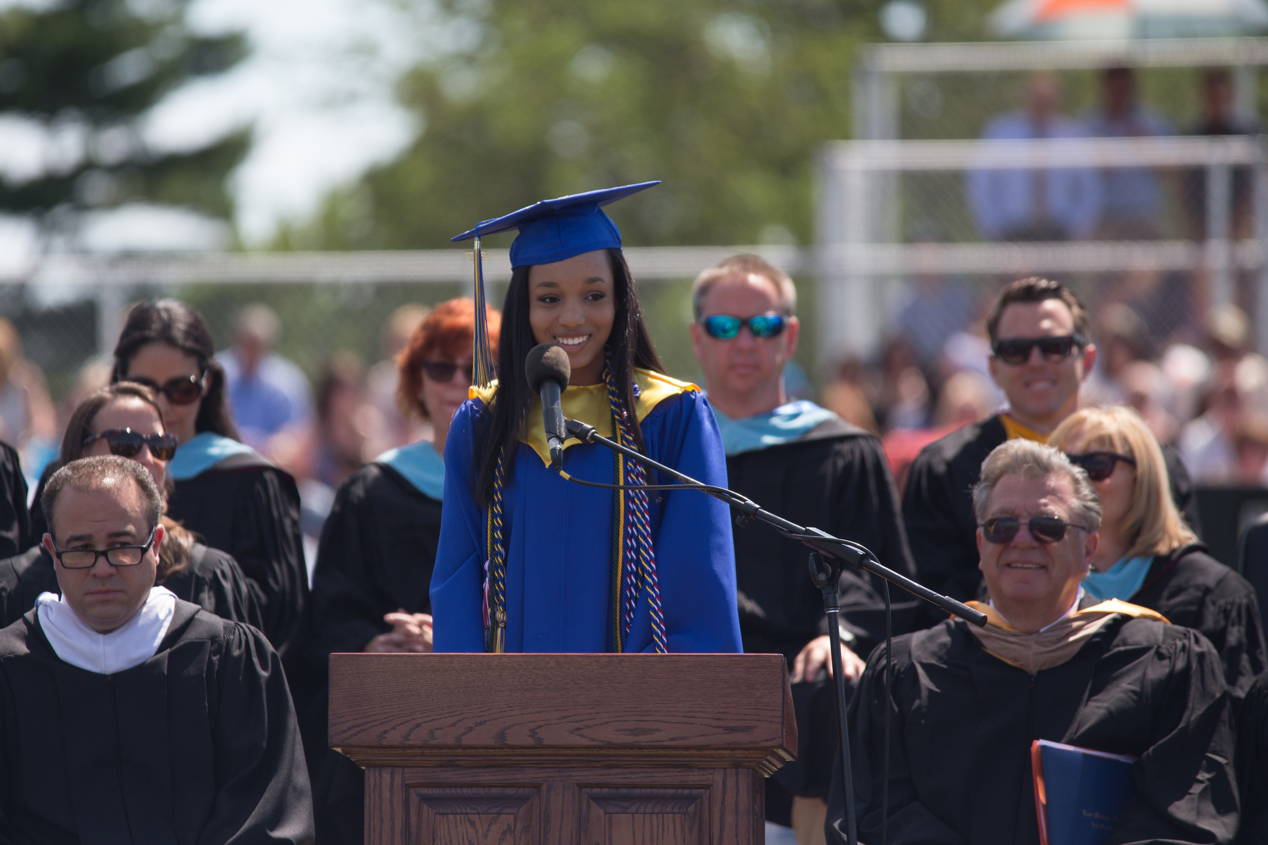 As her peers cheered her on, East Meadow High School’s valedictorian Mahalia Mathelier smiled at the crowd.