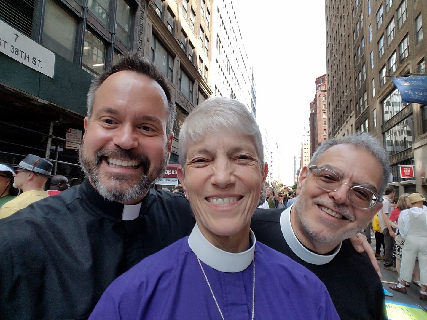 The Rev. J. Christopher Ballard, left, rector of Trinity-St. John’s Church in Hewlett; the Right Rev. Mary D. Glasspool, assistant bishop of the Episcopal Diocese of New York; and the Rev. Michael Delaney, canon pastor of the Cathedral of the Incarnation in Garden City, attended the New York City Pride Parade last year.