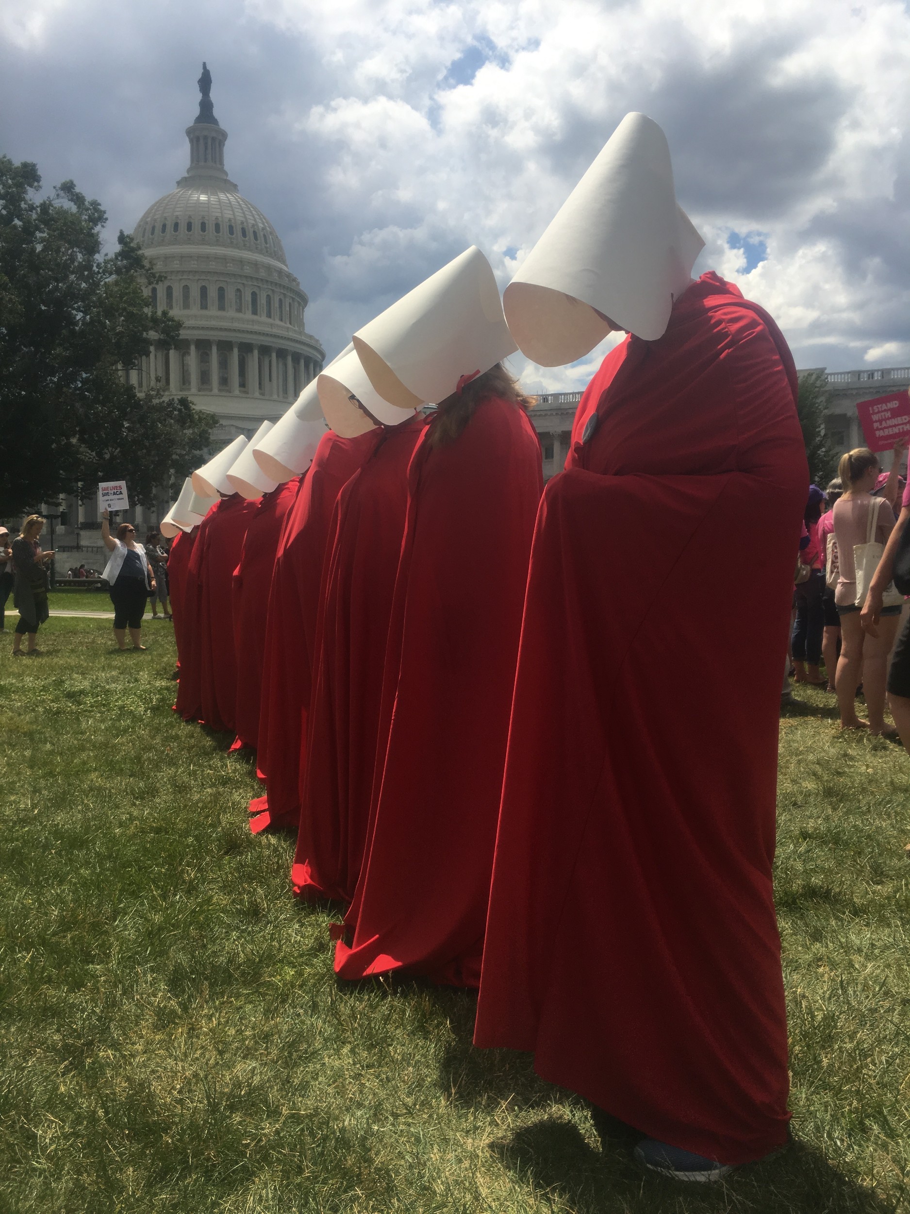 lanned Parenthood volunteers donned outfits worn by a fictional caste of women forced into sexual servitude in Margaret Atwood’s dystopian novel “The Handmaid’s Tale,” at a rally in the capital.