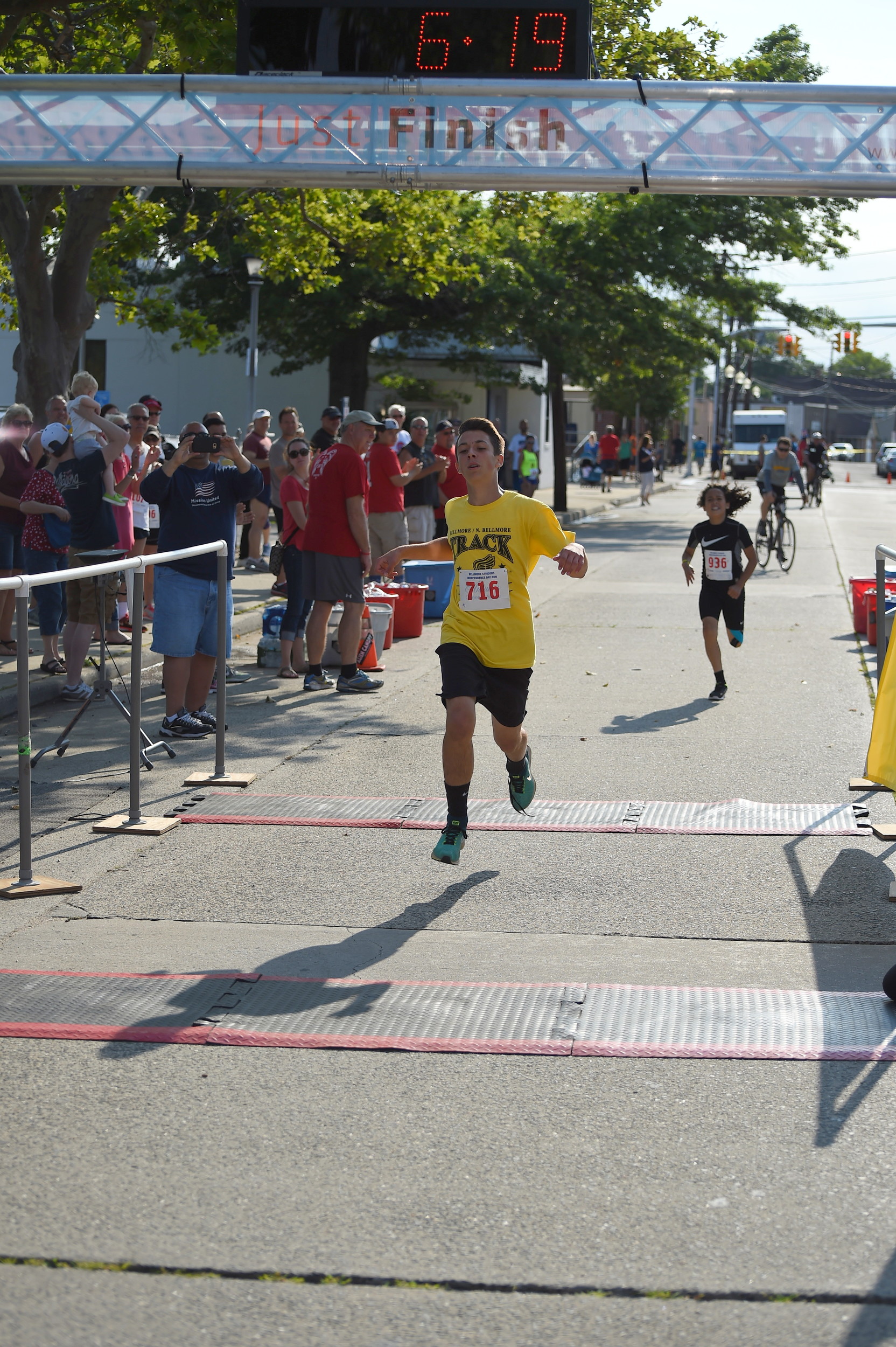 Anthony Scotto, 13, of North Bellmore, crossed the finish line in the one-mile race.