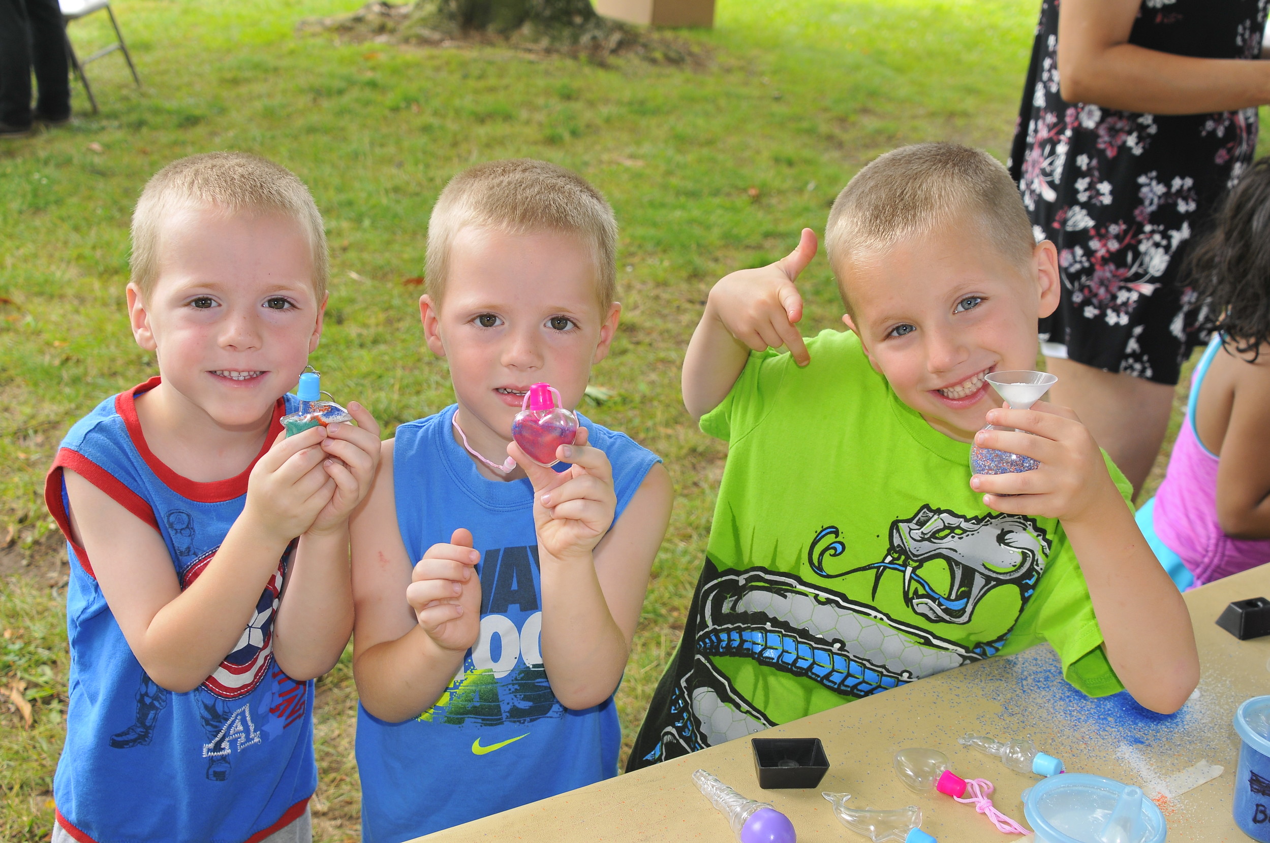 Blake, left, Kameron and Landon Tamberelli had a fun time creating sand art at the 20th annual Lazy Days of Summer festival in Levittown.