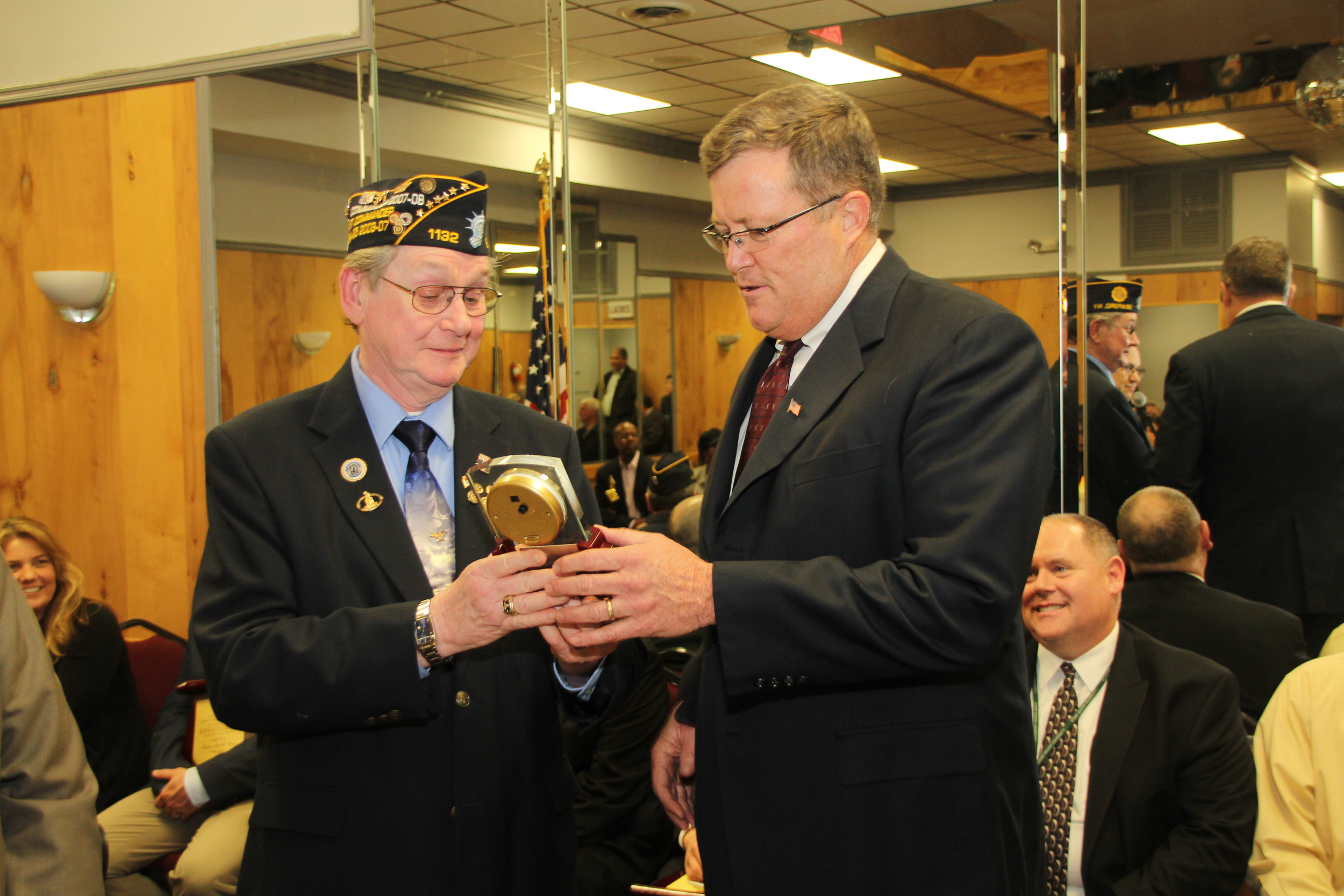 Bill Harms, commander of Seaford American Legion Post 1132, presented Brian Conboy with the group’s Special Recognition Award in April. Several community organizations honored Conboy before his retirement this month.