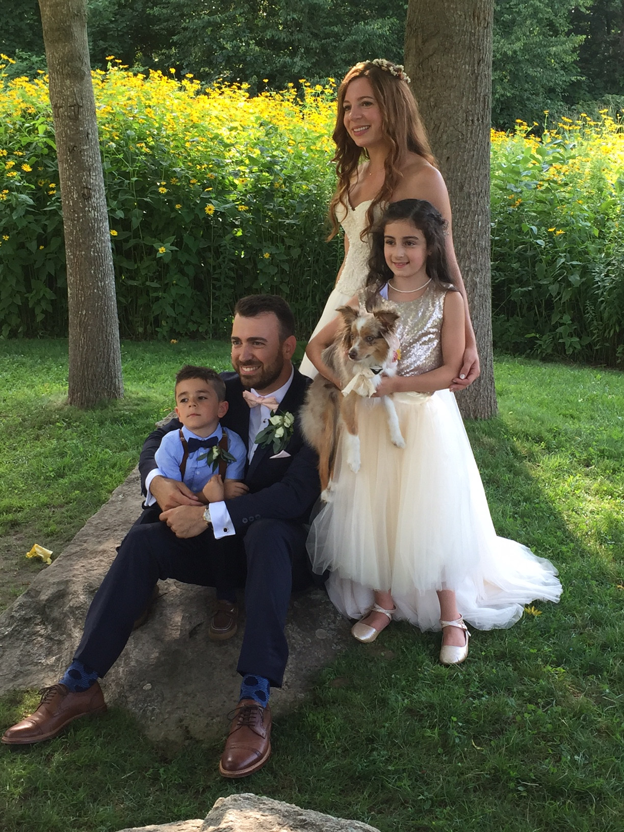 Newlyweds Andrea Swift Argyros and John Argyros last week with their flower girl, ring bearer and dog, Mila.
