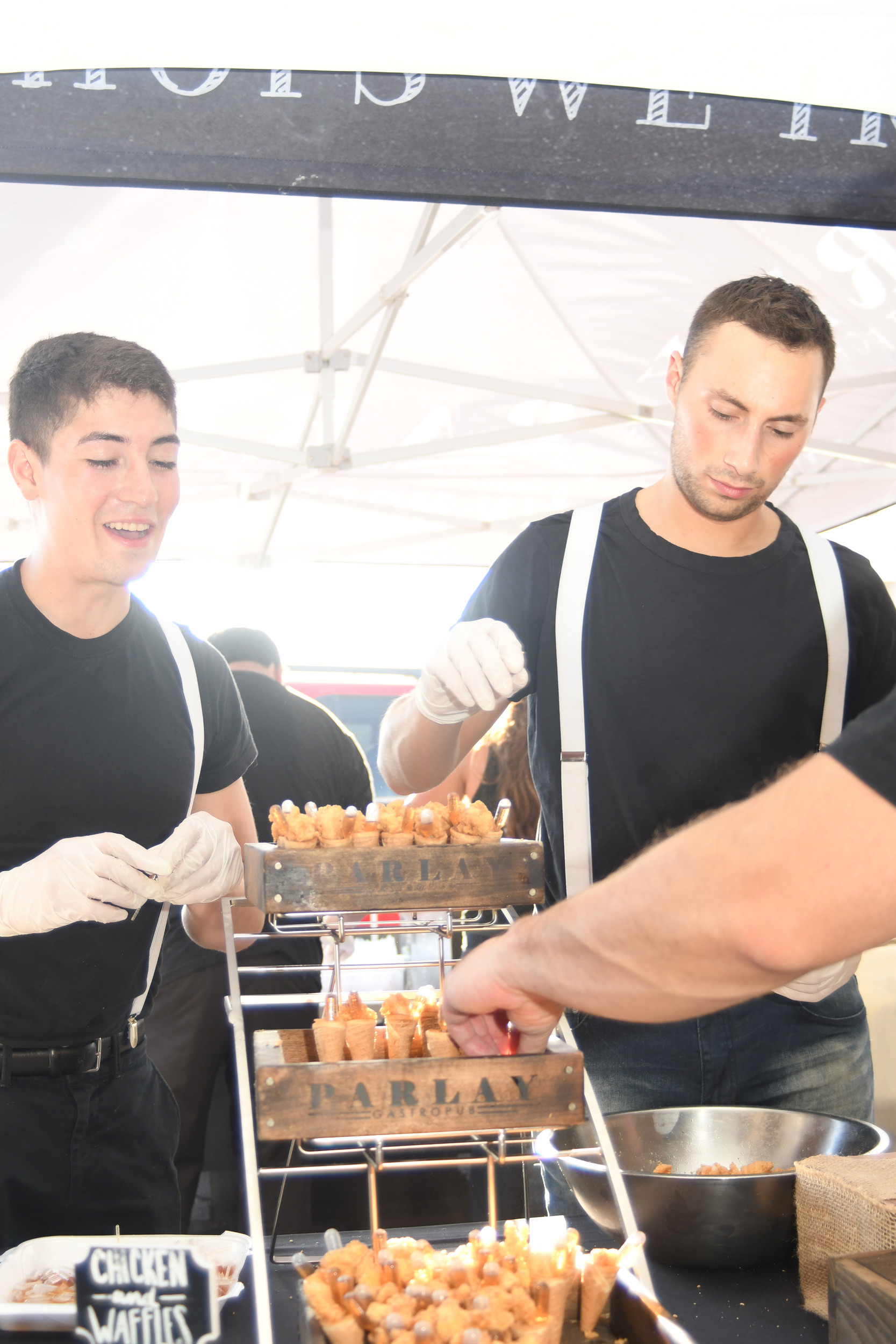 Sean Castaneda, left, and Vincent Lopez of Parlay Gastropub in Rockville Centre, offered hungry guests chicken and waffle cones with maple syrup and macaroni and cheese.