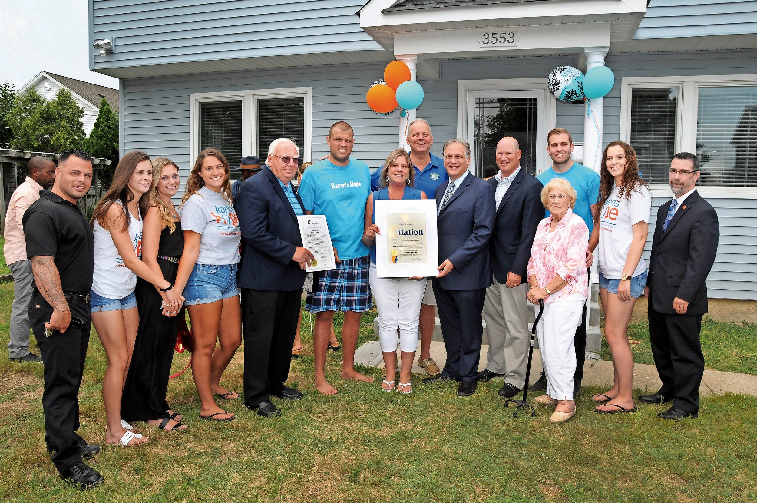 Karen’s Hope founders, volunteers, State Sen. John Brooks and County Executive Ed Mangano celebrated the renovation of a house for two disabled adults on July 28.