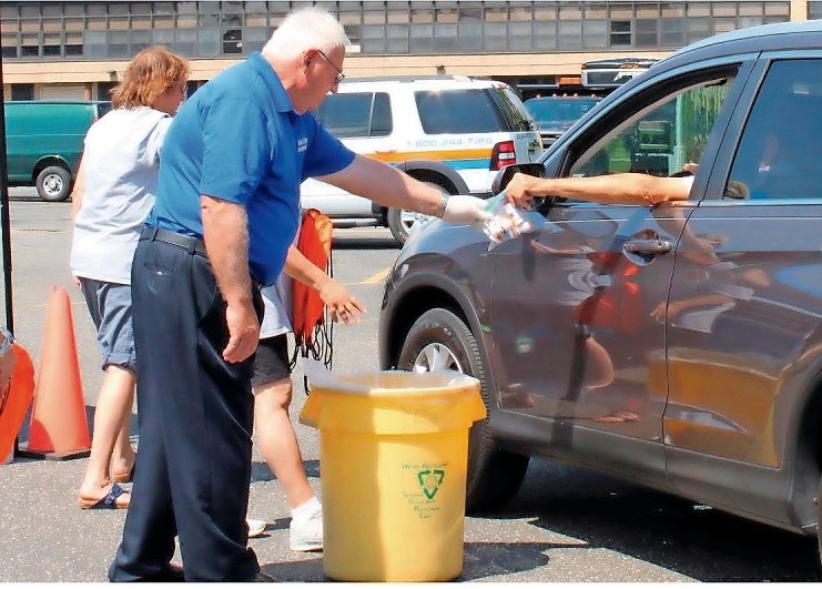State sen. John Brooks dropped community members’ expired medications into safe bins at the Drug Take-Back Day event on Aug. 19