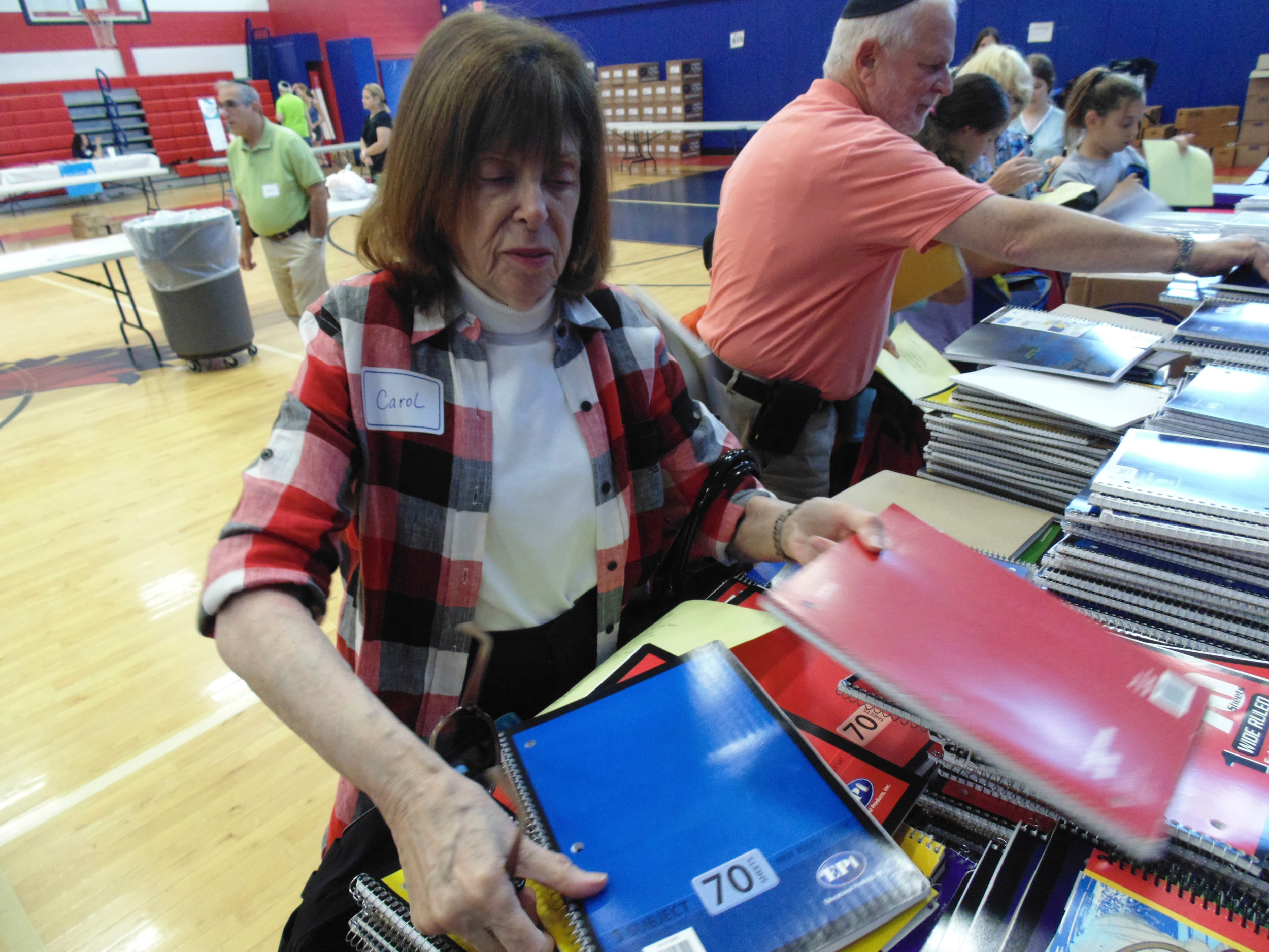 Spiral notebooks were collected by volunteer Carol Lippman before the items went into the backpacks.