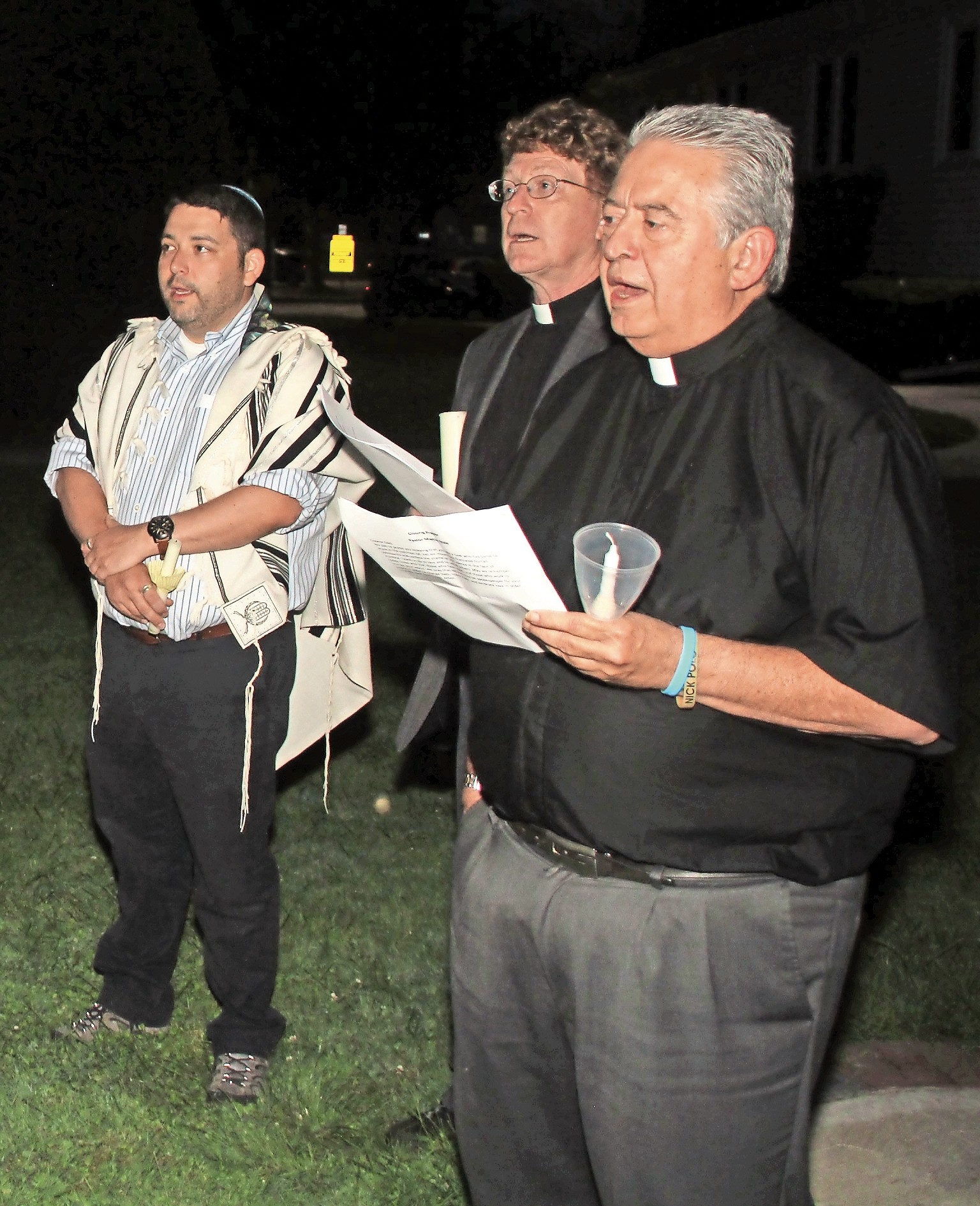 Rabbi Daniel Bar-Nahum, far left, of Temple Emanu-El of East Meadow; the Rev. Martin Nale, pastor of Christ Lutheran Church of Wantagh; and the Rev. Gregory Cappuccino, pastor of St. Frances de Chantal Roman Catholic Church, in Wantagh, sang the national anthem.