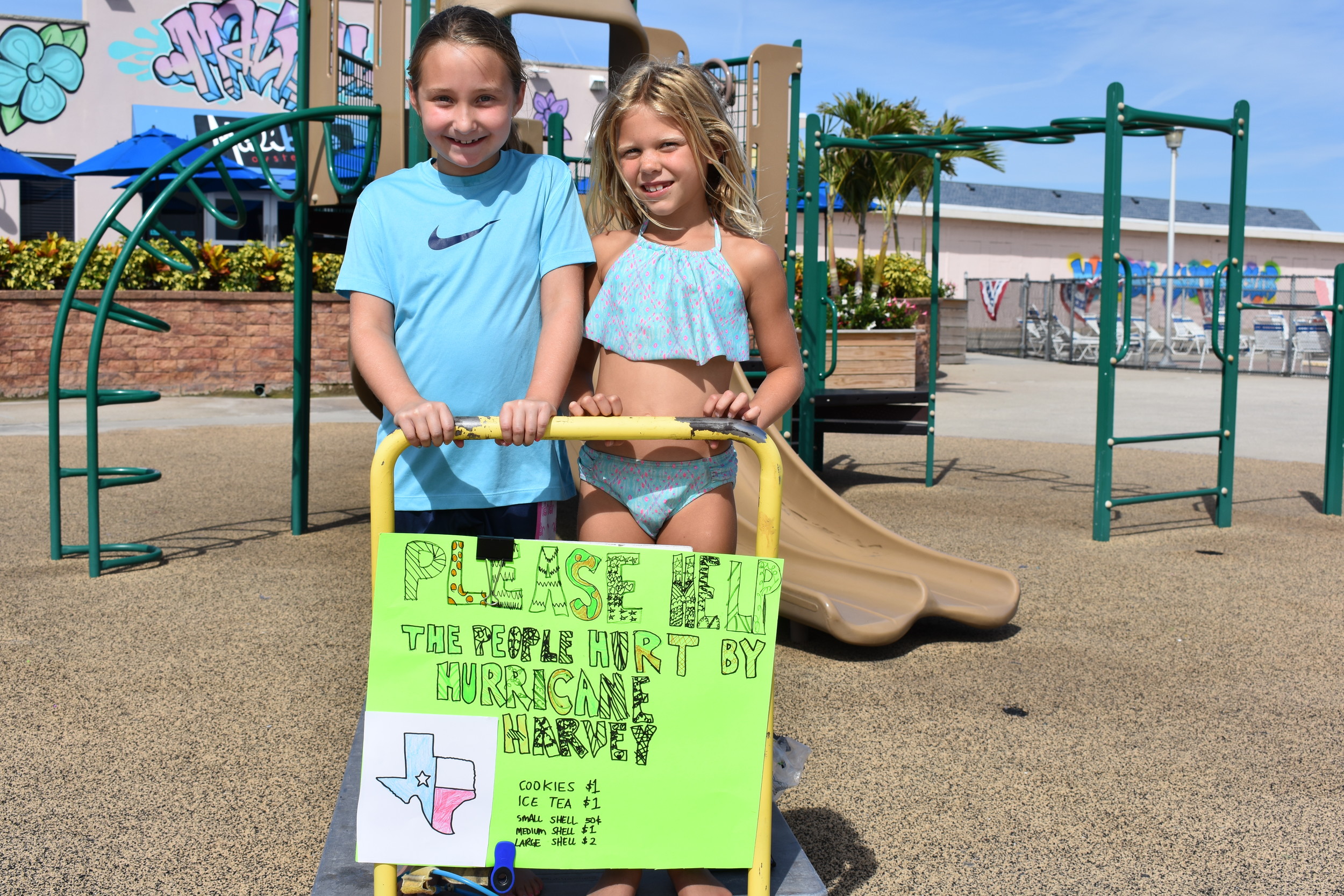 Rockville Centre resident  Kiersten Brull, 7, right, with her friend Maeve Martin, raised money for Hurricane Harvey victims by selling seashells, iced tea and cookies.
