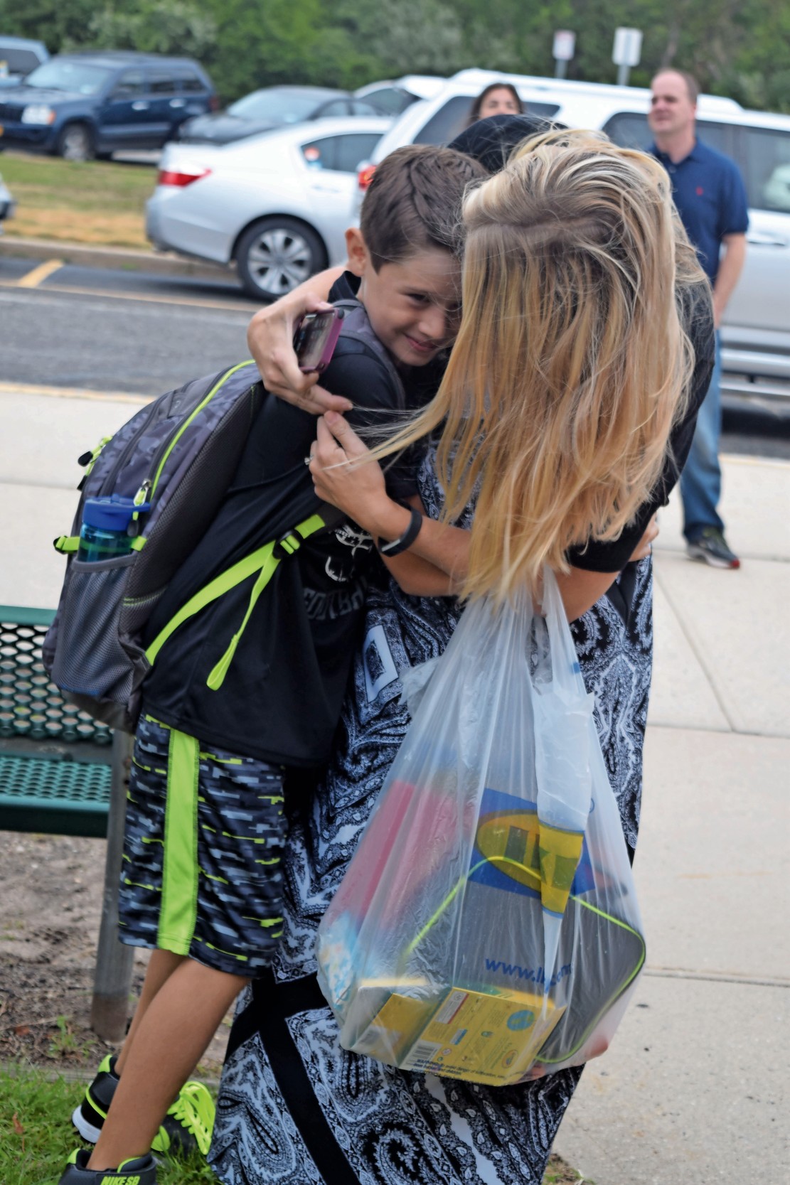 Jen DiPietro hugged her son Jack, 8, before sending him off to third grade at Harbor last year.