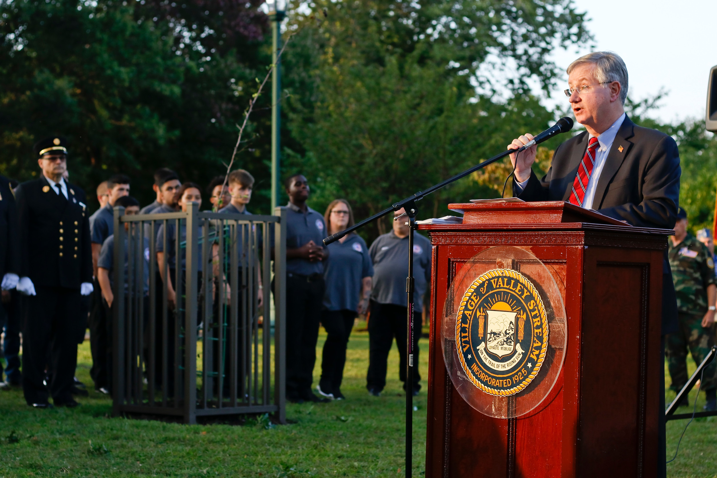 Master of Ceremonies, Jude Robert Bogle, addressed the gathered crowd of residents, fire fighters, veterans, boy scouts, girl scouts and local politicians who gathered for this years September 11 remembrance ceremony.