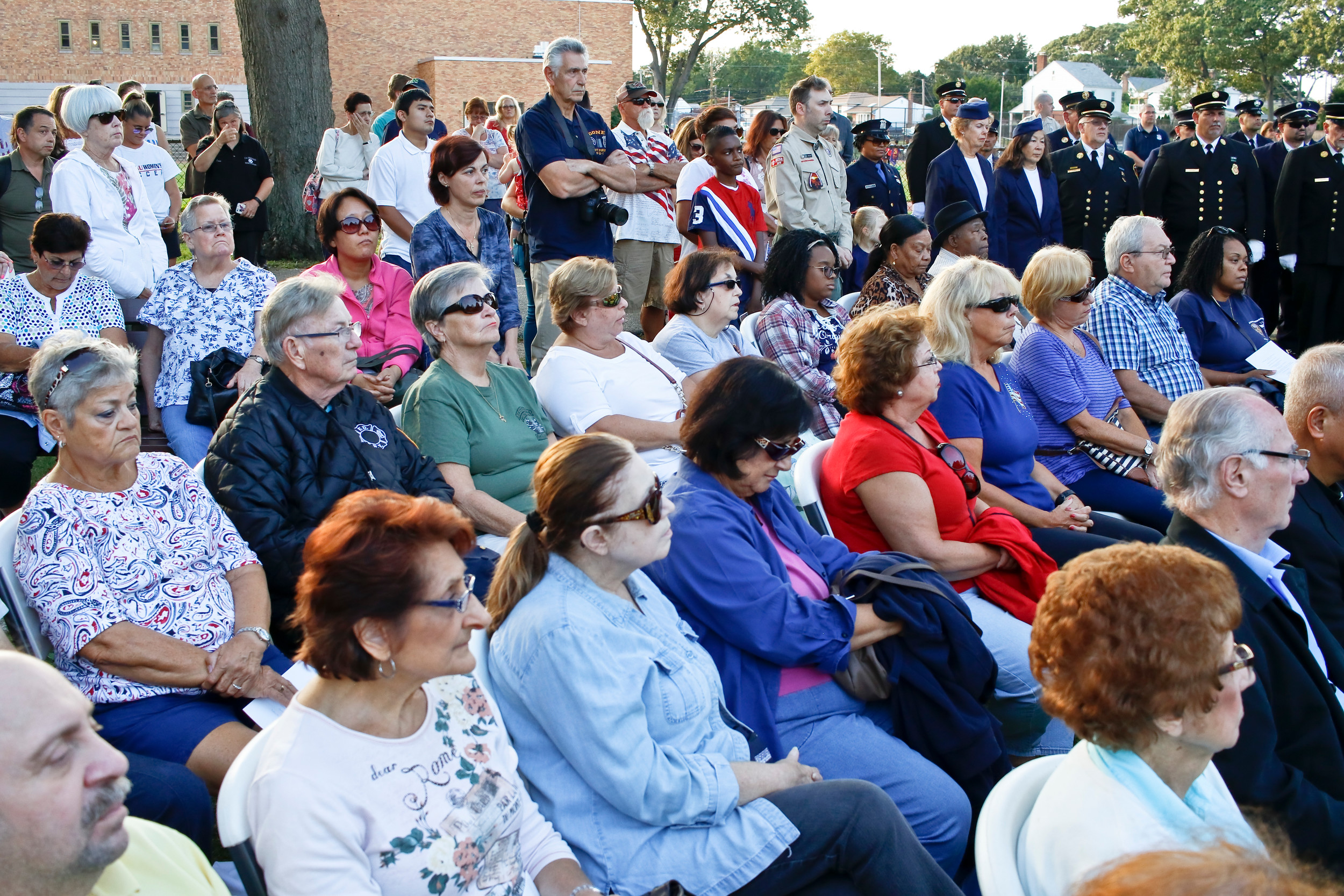 Hundreds of residents gathered for the annual ceremony at Hendrickson Park. Six years ago, the village added a memorial site dedicated to the attacks, with a steel beam from the destroyed World Trade Center positioned on two cement columns that point toward 1 World Trade. In 2015, the village acquired two "Survivor Tree" saplings that grew out of the charred trunk of a Callery pear tree that was uncovered under the rubble of the twin towers.