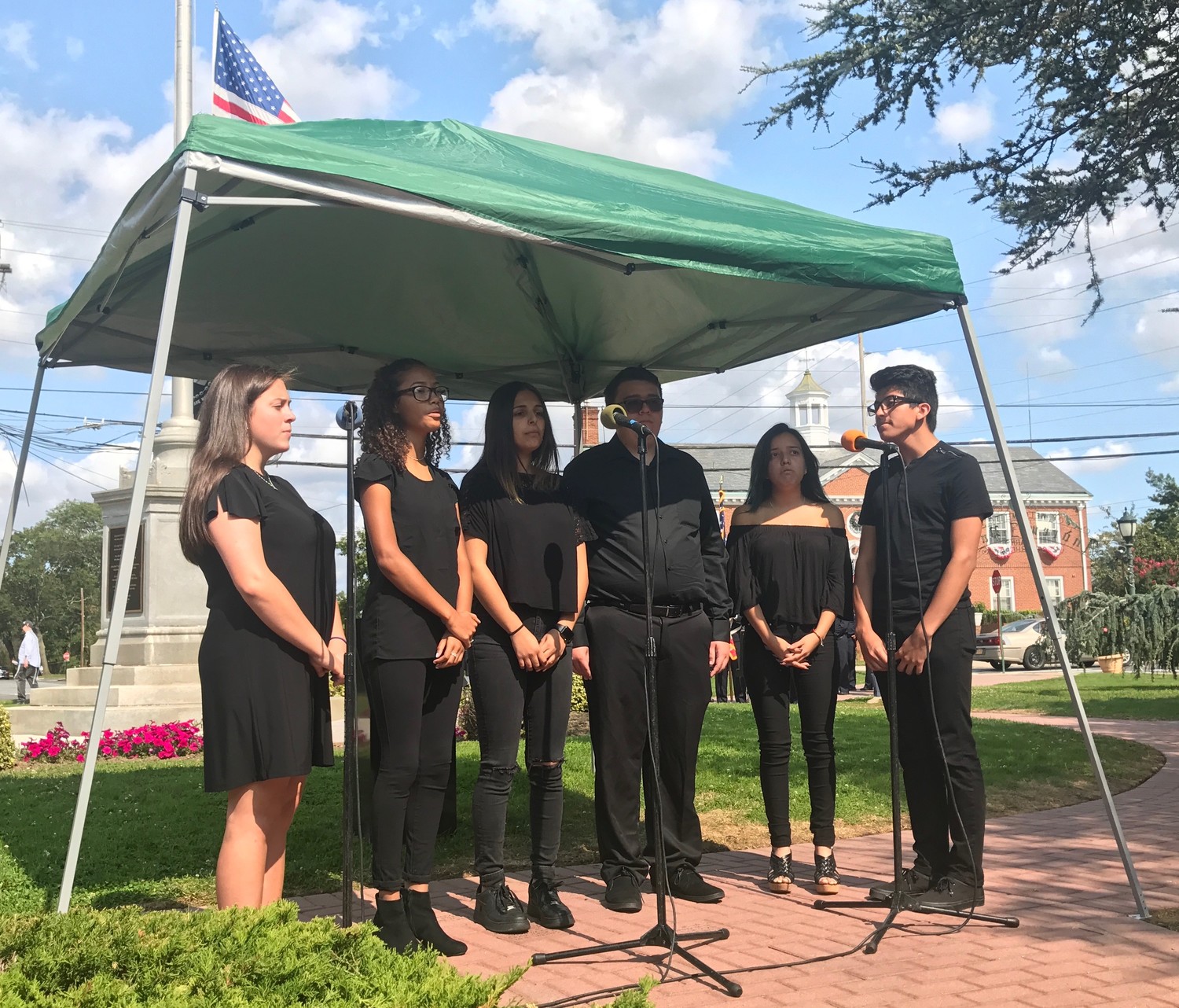 Lawrence High School’s acapella ensemble closed the ceremony with a rendition of  “God Bless America.”