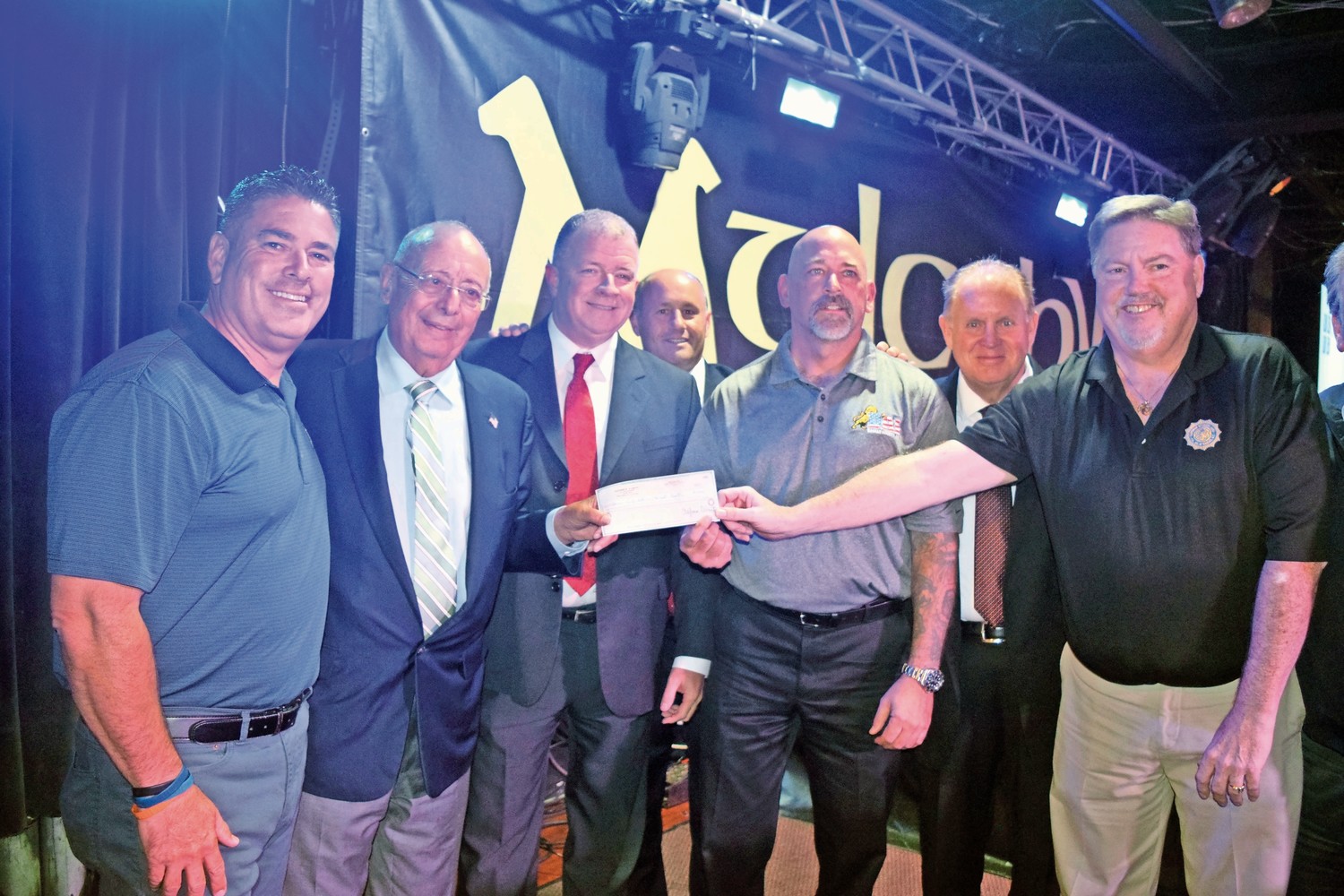 Nassau County Police unions held a fundraiser to help the victims of Hurricane Harvey at Mulcahy’s Pub and Concert Hall on Sept. 6, collecting more than $120,000. From left were Nassau County PBA President James McDermott; Al D’Amato, a former U.S. senator; COBA President Brian Sullivan; Police Commissioner Patrick Ryder; DAI President John Wighaus; John Murray, the owner of Mulcahy’s; and SOA President Kevin Black announced that D’Amato donated $50,000.