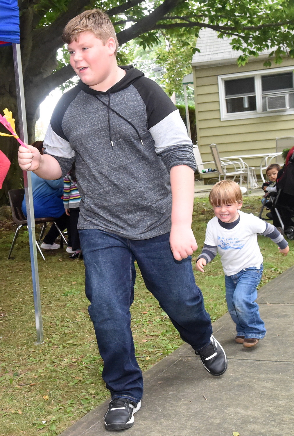Two-year-old Luke chased his brother, Mathais Kraus, 12, throughout the festival at Holy Trinity Orthodox Church’s annual festival.
