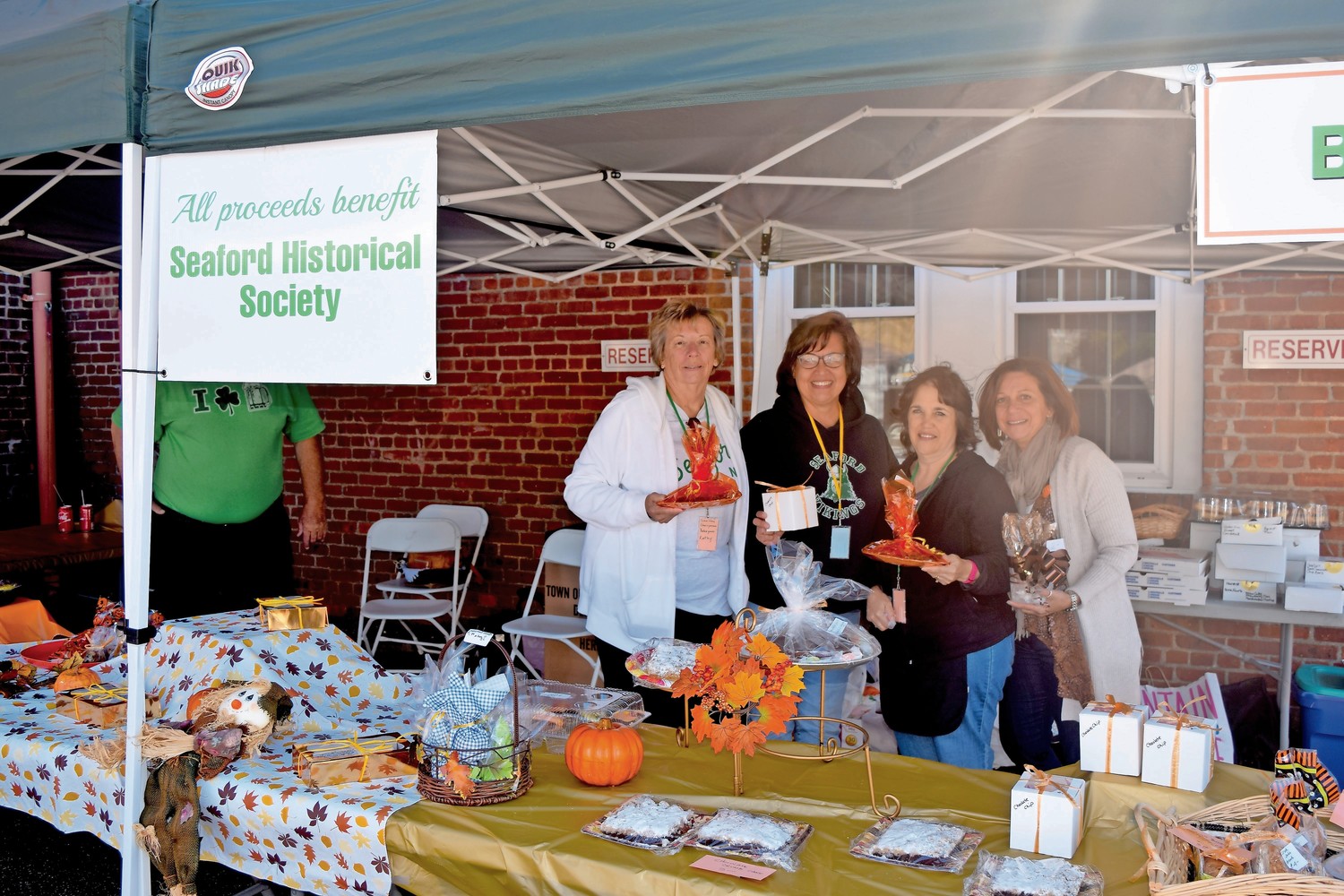 Kathy Weeks, far left, Alice Soliwoda, Sue Nicola and Angela Egan raised money for the historical society at the Harvest Fair last year. The 11th annual festival will be held on Sunday in the community museum parking lot.