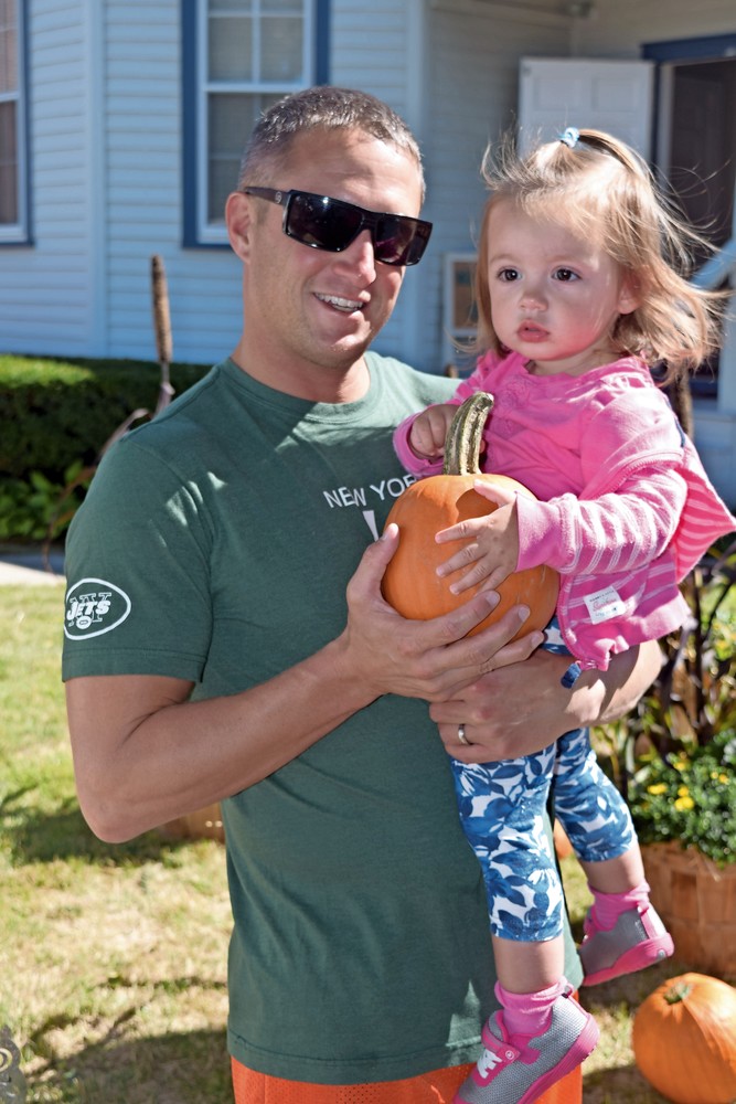 Pete Marques picked pumpkins with his daughter, Julia, at last year’s fair.
