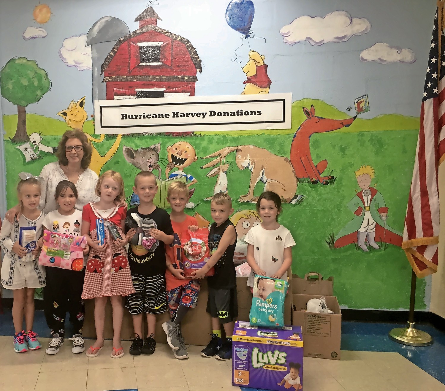 Cheryl Schwartz, back left, a first-grade teacher, conceptualized Mandalay Elementary School’s Hurricane Harvey relief drive. Her students donated supplies, which were sent to storm victims.