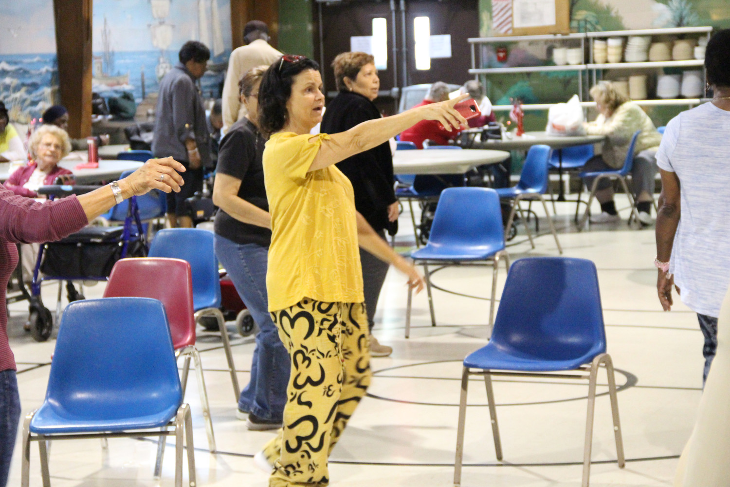 Certified Yoga Instructor Anne Moffatt, 56, showed the exercise class how to do the dance steps at the senior center off Church Street in Freeport.