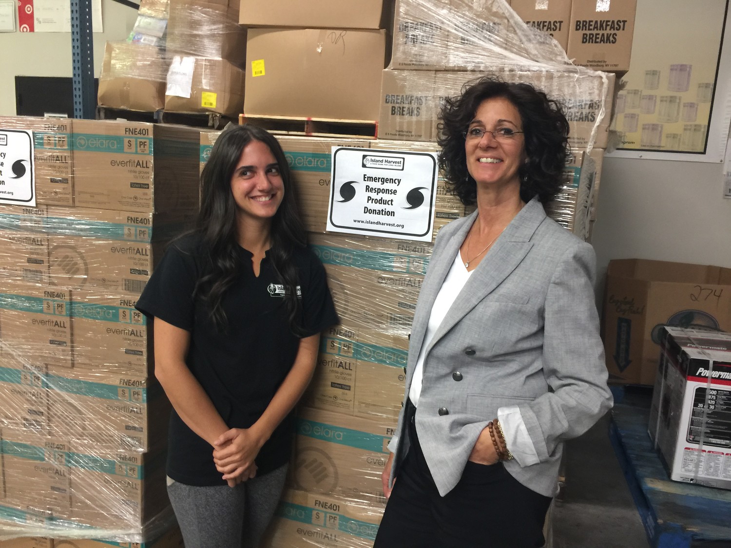 Rebecca Dresner, left, flew to Puerto Rico on Monday to help distribute food collected by the Island Harvest Food Bank. Her mother, Randi Shubin Dresner, president and CEO of the hunger-relief organization, said that Island Harvest had collected more than half a million pounds of nonperishable food, bottled water and cleaning supplies since early September to aid hurricane-stricken areas.