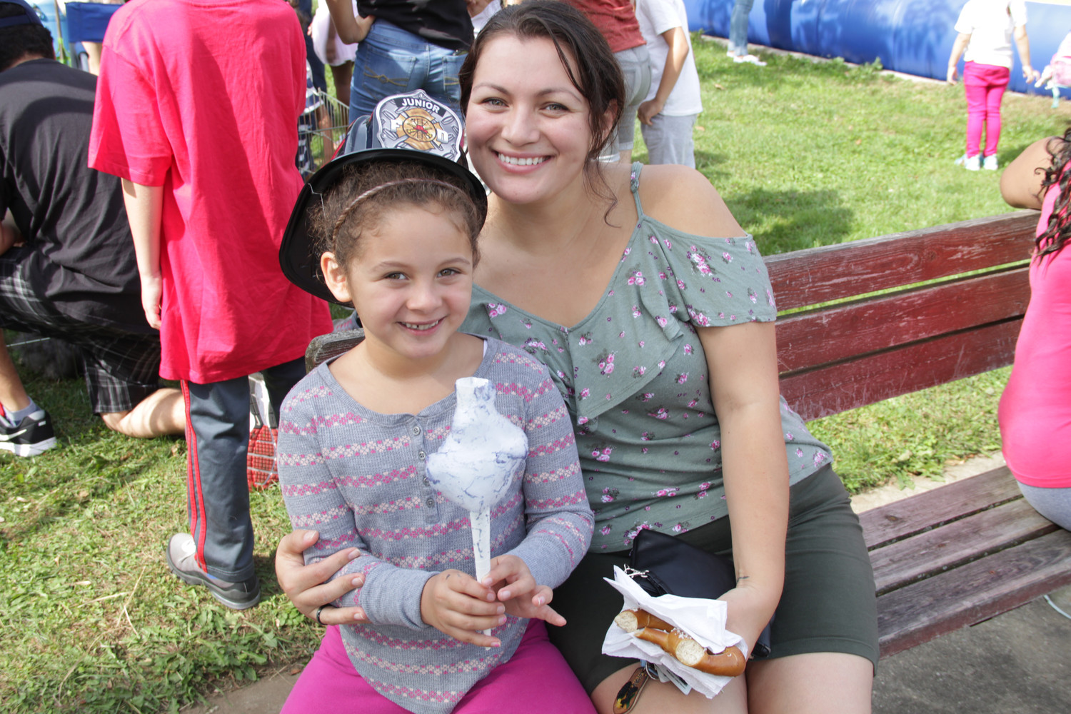 Karissa Lazo, 7, and her mom Yolonda Lazo enjoyed cotton candy and a soft pretzel during the Freeport Memorial Library Fall Festival on Oct. 7.