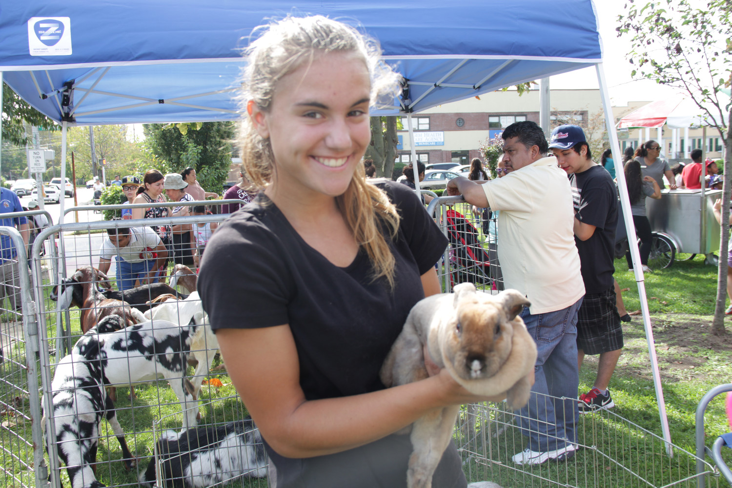 Library volunteer Kailyn Reynolds, 16, looked after the bunnies and chickens during the festival’s petting zoo.