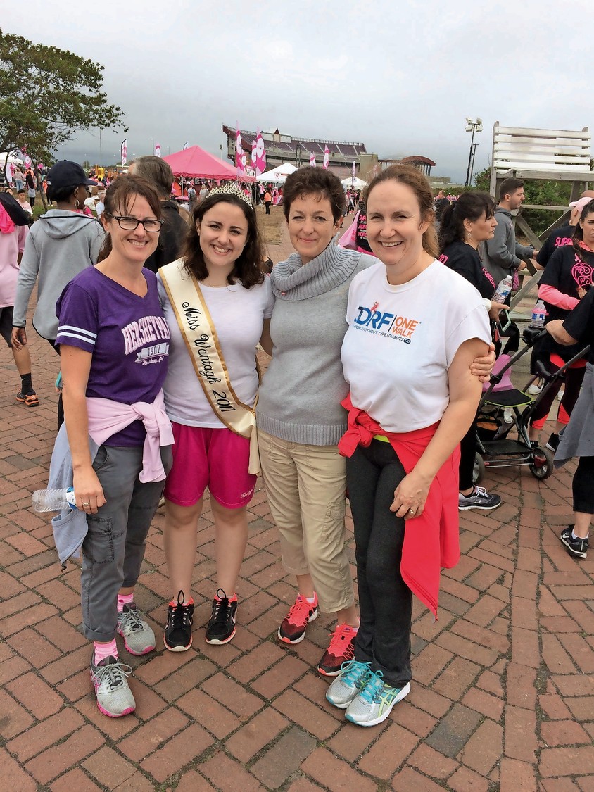 Members of the Wantagh community came out to the event to support breast cancer survivors. From left, Victoria Walsh, Miss Wantagh Samantha Walsh, Rita Nolan and Aileen Campbell stood by the start line at Field 5.