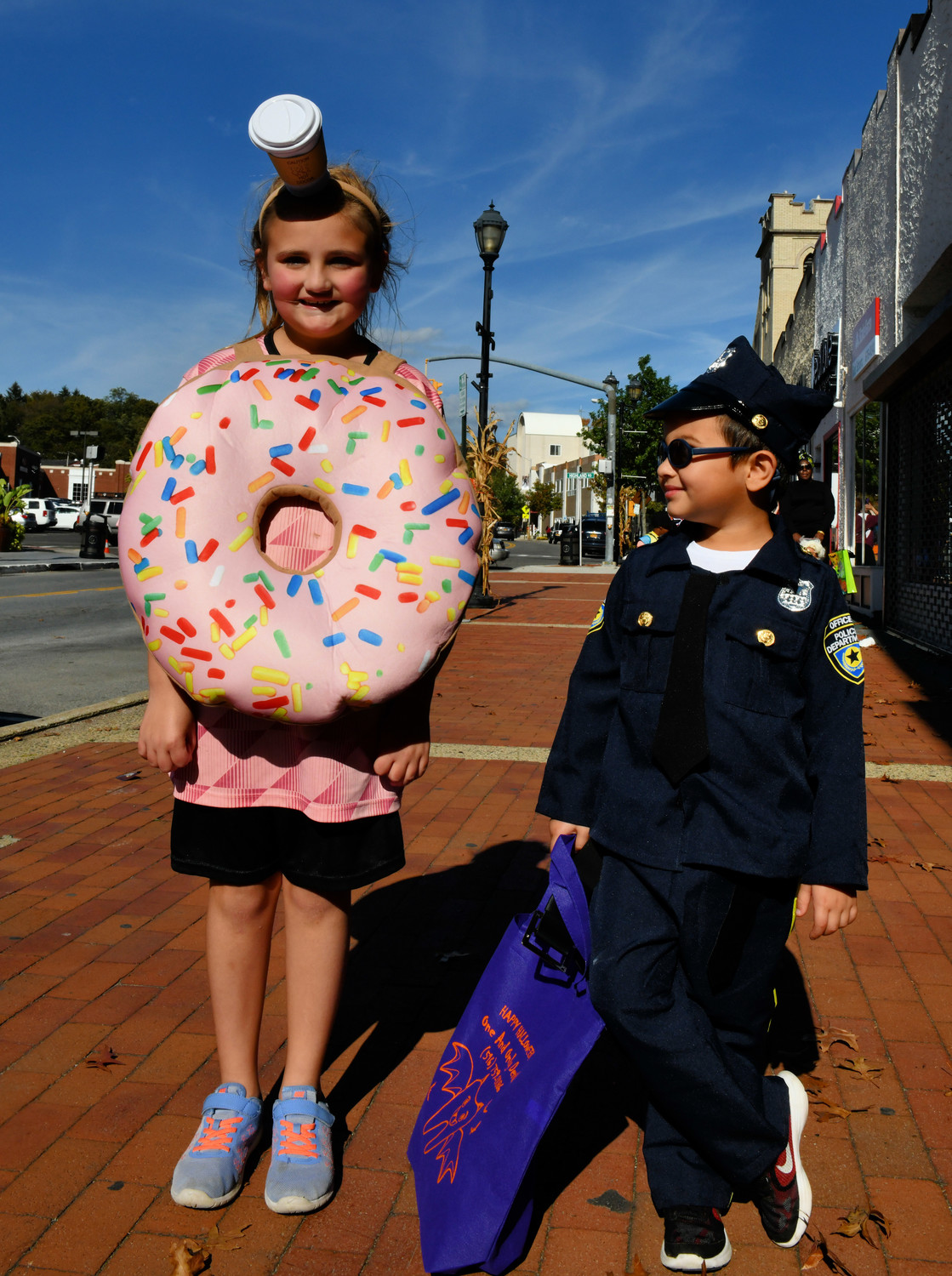 The annual BID Halloween Parade on Saturday was the perfect preview for Tuesday’s day of candy. It included all kinds of costumed marchers, including Ella Wohltmann, left, and Desmond Sahai.