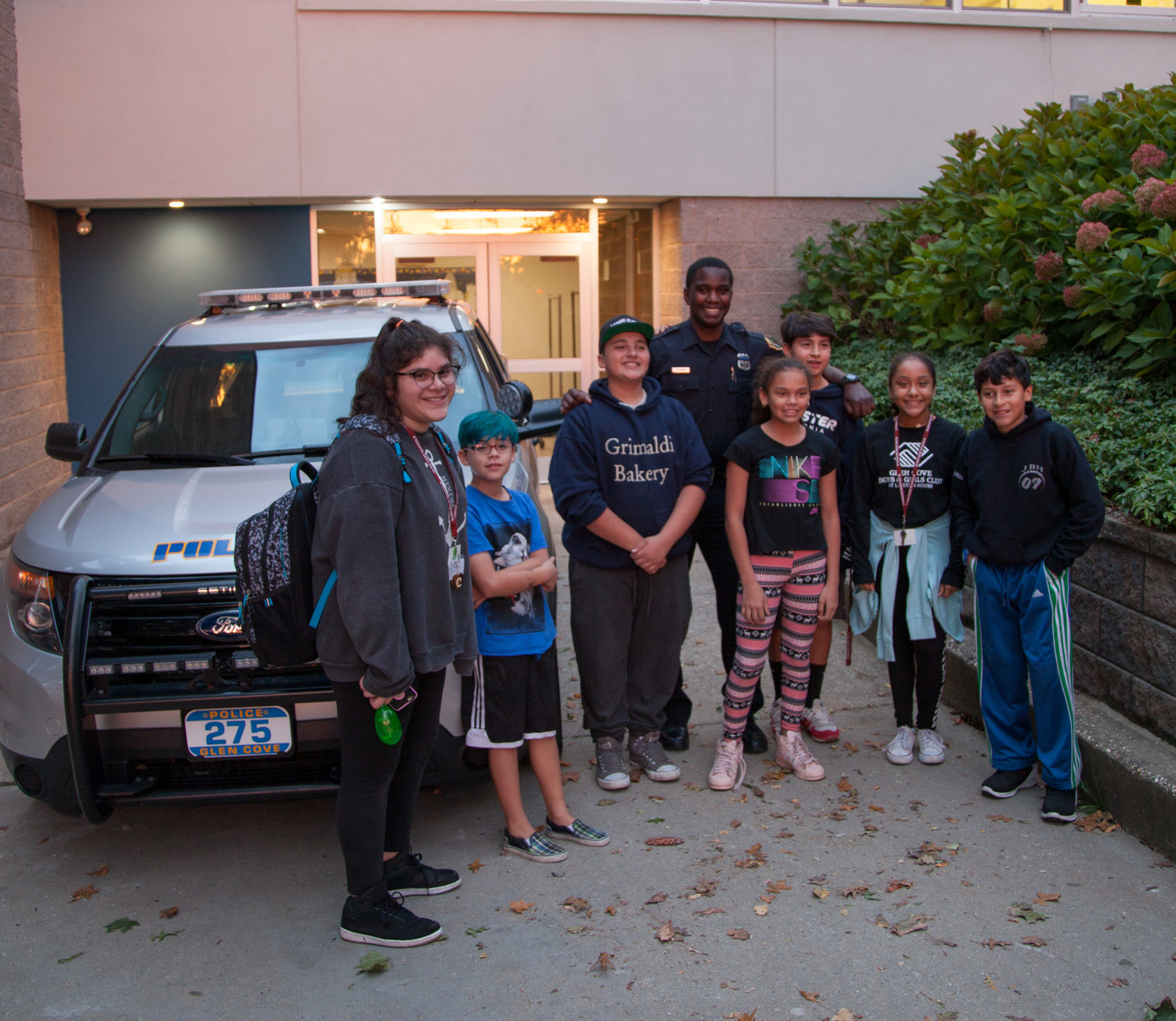 Glen Cove Police Officer Pittman showed the kids a police vehicle at the GCB&GC Lights on Afterschool event on Oct. 26.