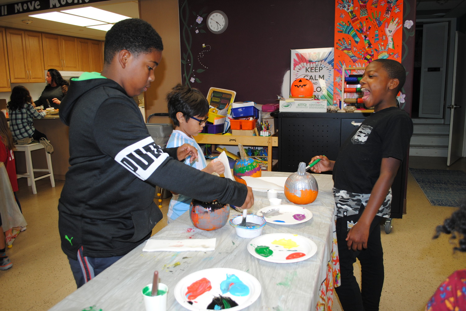Chris Diggs, 10, Derek Polo, 7, and Derrick Brown, 10, decorated pumpkins at the Youth Bureau’s Lights on Afterschool event.