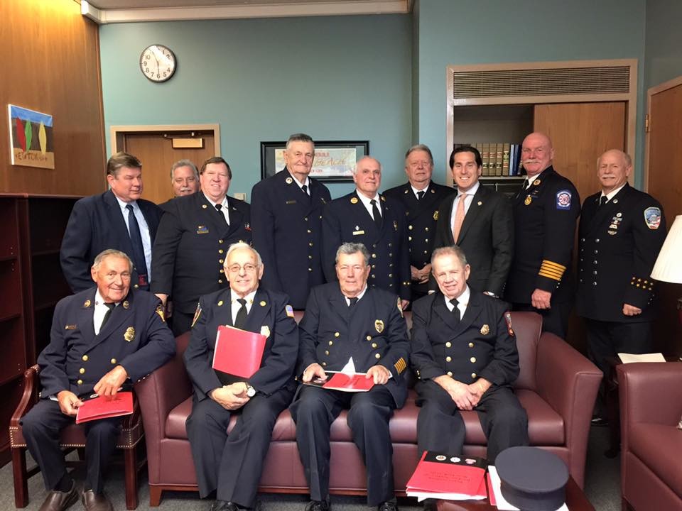 FASNY’s Steven Klein, back row, fourth from right, and representatives from the Oceanside, Inwood and Hewlett Fire Departments met with state Senator Kaminsky, back row, third from right, to discuss expanding cancer coverage for volunteers.