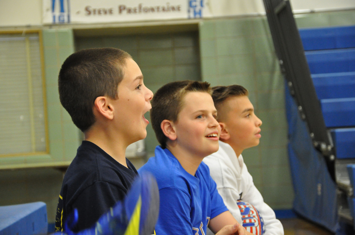 Patrick Crowe, left, Liam Glynn and Nicholas Decker enjoyed the game from the sidelines.