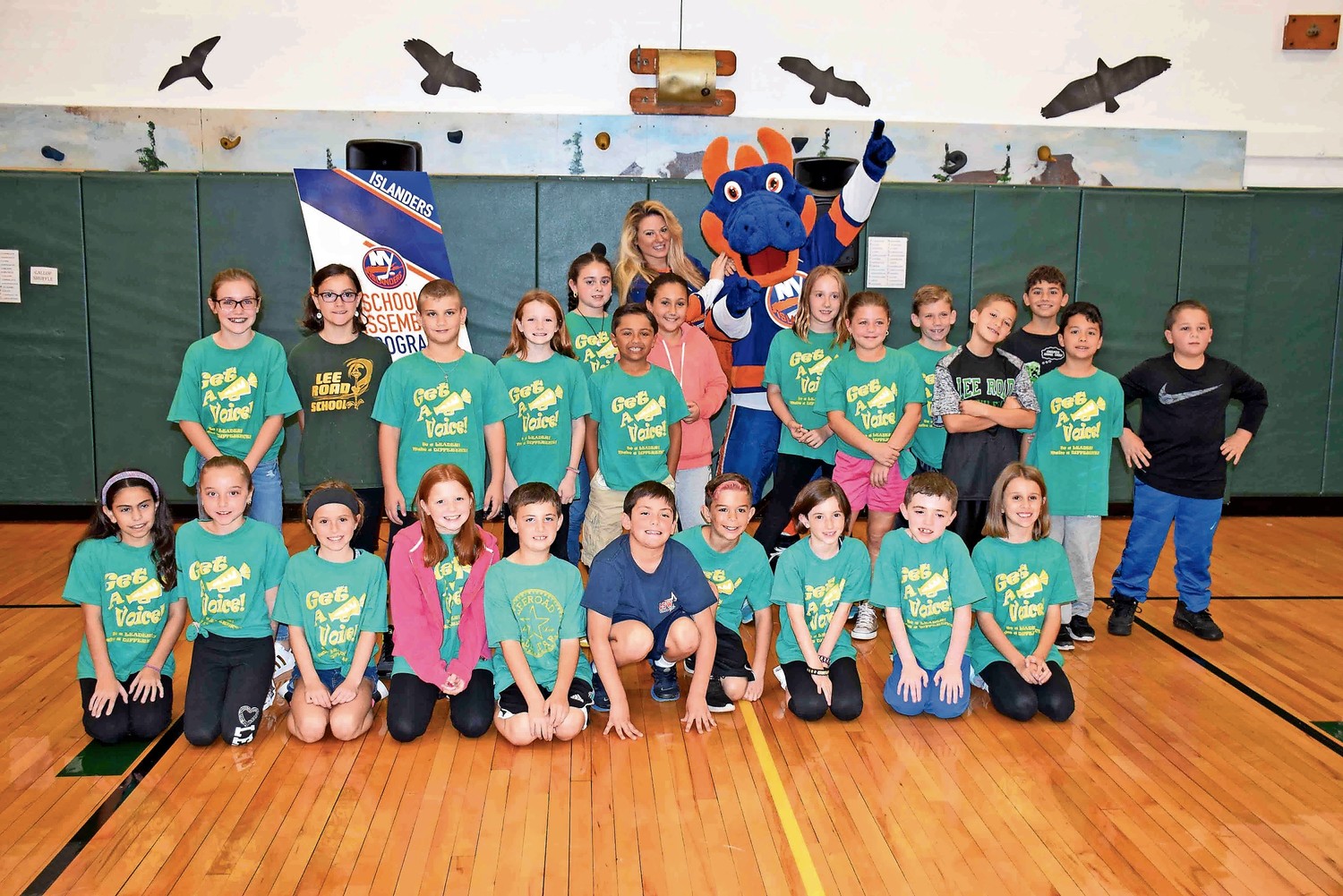 Fourth-grade students at Lee Road Elementary School celebrated the 10th year of its Get-A-Voice Character Education Program on Oct. 24. New York Islanders representative Dina Tsiorvas and mascot Sparky the Dragon attended the kickoff.