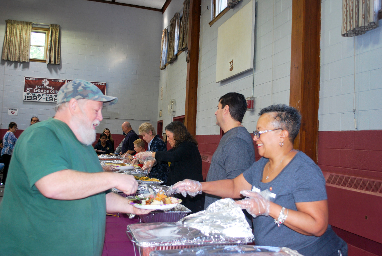 Valley Stream Lions member Monica Dingle provided service with a smile at The Club’s Thanksgiving Day lunch at the St. Joseph School in Hewlett on Nov. 20.