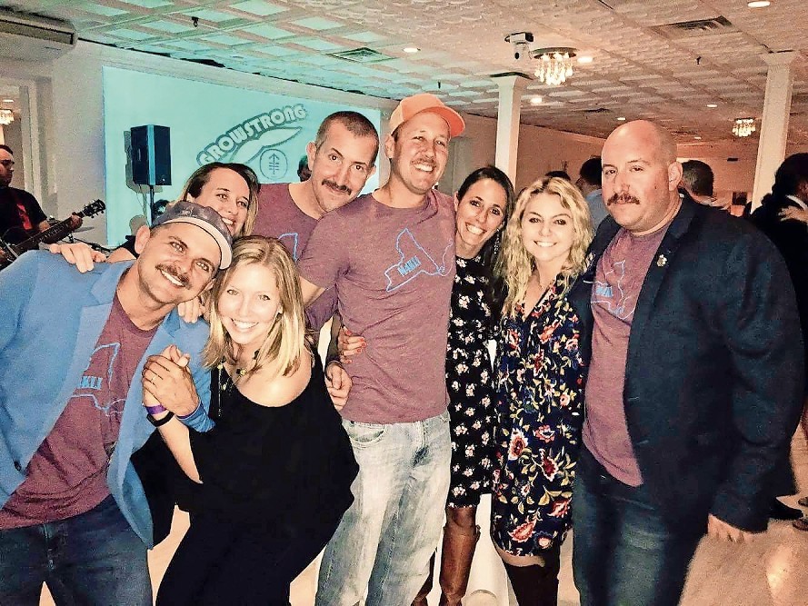 James and Stacey Bogdan, left, Holly and Vinny Leis, Billy and Jackie Kupferman, and Sarah and Justin Fitzmartin at Mustaches for Kids’ annual ’Stache Bash at the Long Beach Hotel on Nov. 4.
