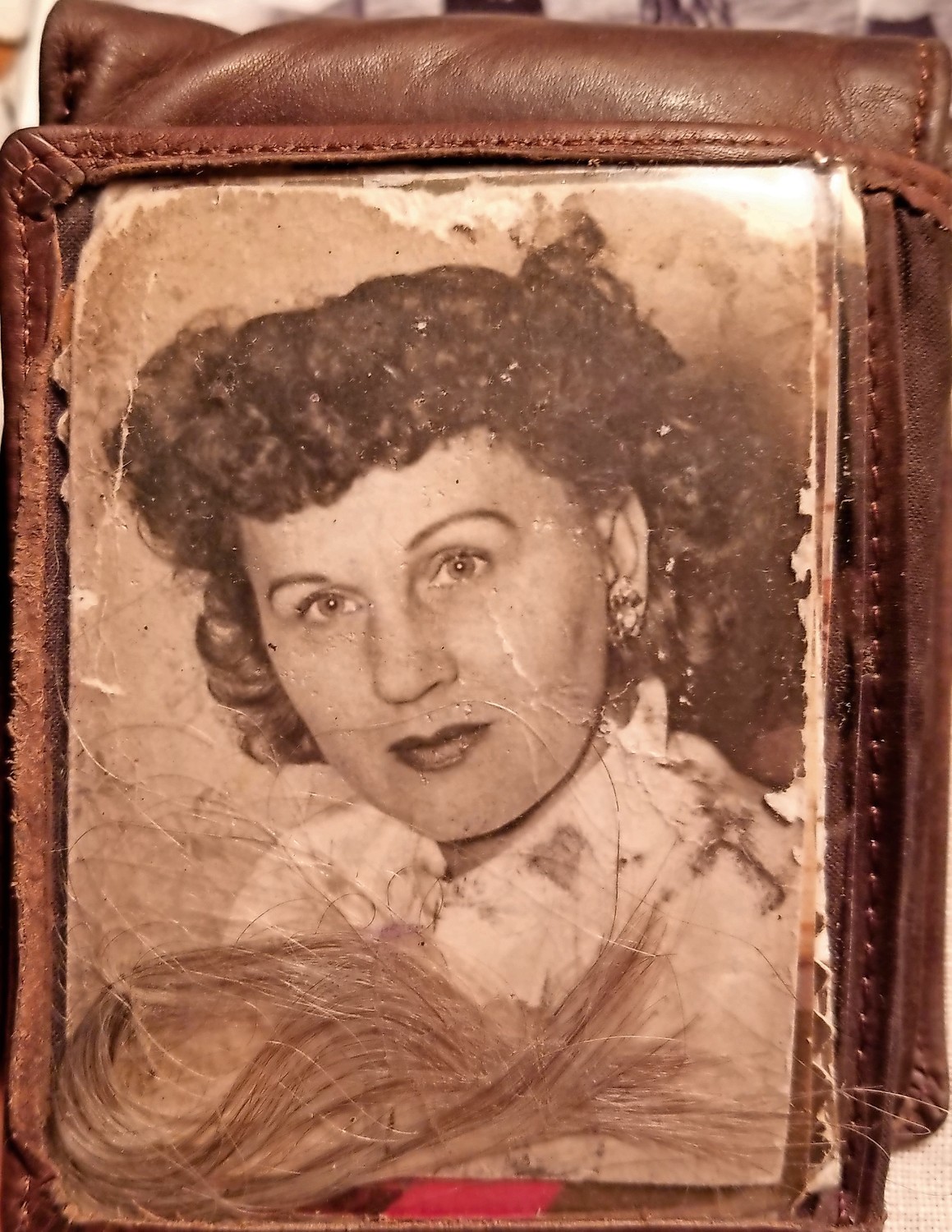 Charlie Franza keeps a photo he took of his late wife, Nettie, in a wallet showcased in his room. He slipped a lock of her hair in the pocket, he said.