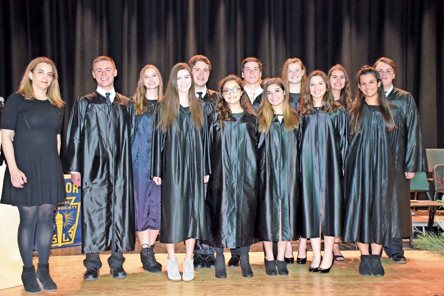 The Wantagh High School National Honor Society inducted 81 students into the organization. Adviser Kali Psihos, far left, stood with the executive board at the candlelighting ceremony. on Nov. 28.