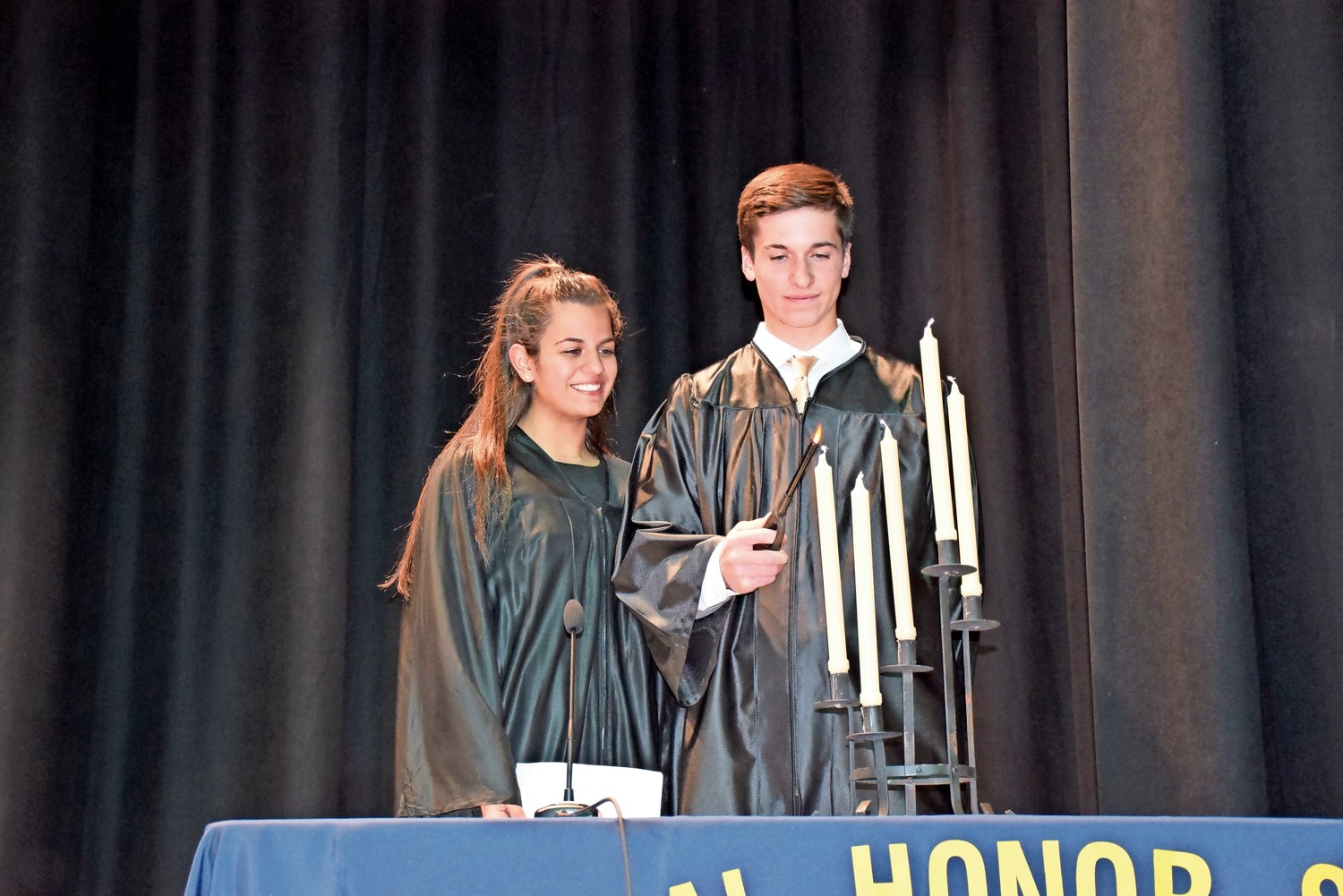 National Honor Society Corresponding Secretary Brianna Legovich and trustee Ryan McCarty lit the ceremonial candles during the induction ceremony.
