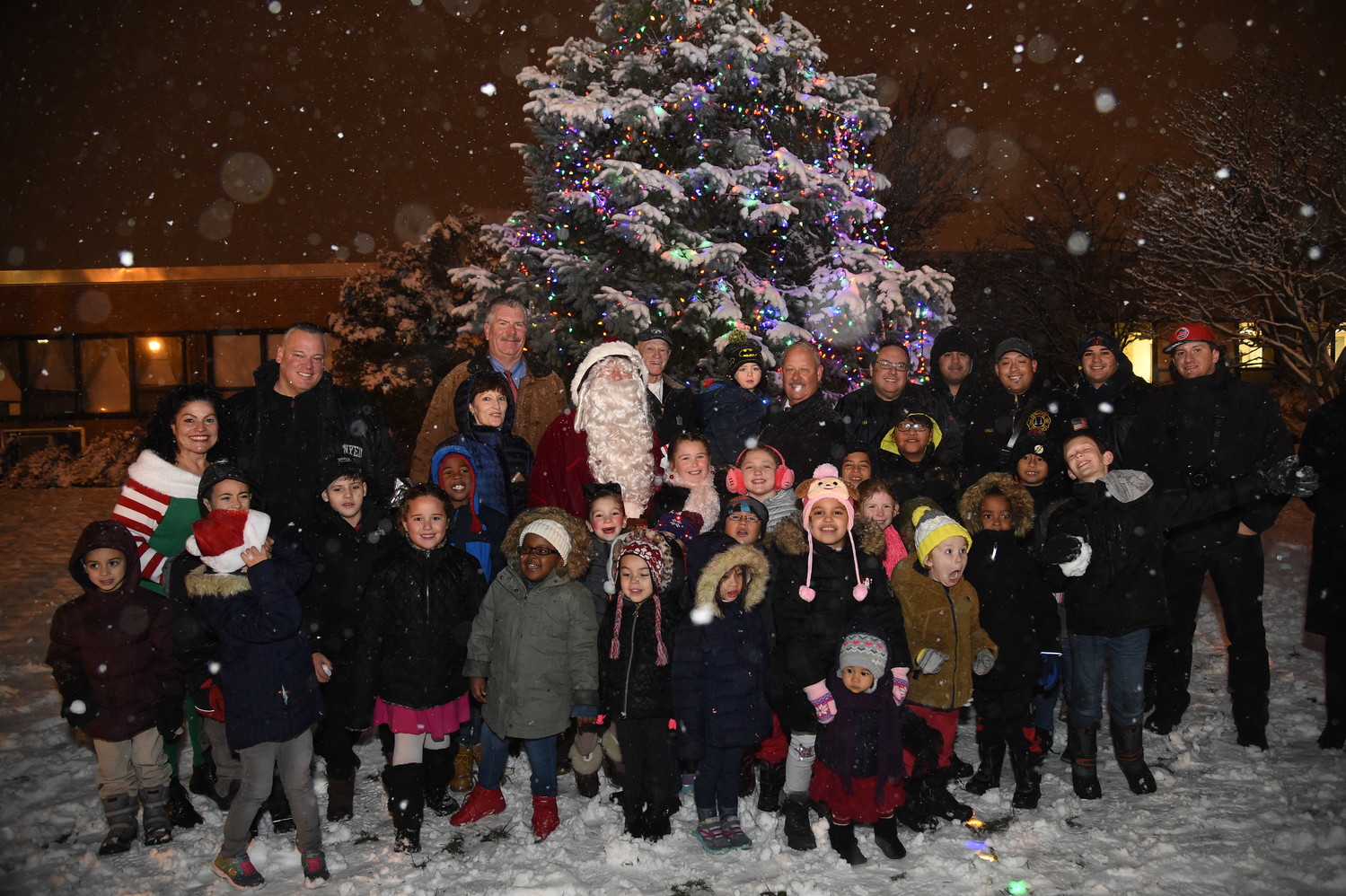 Freeporters along with huddled around Santa Clause after the lighting of the village’s Christmas tree.