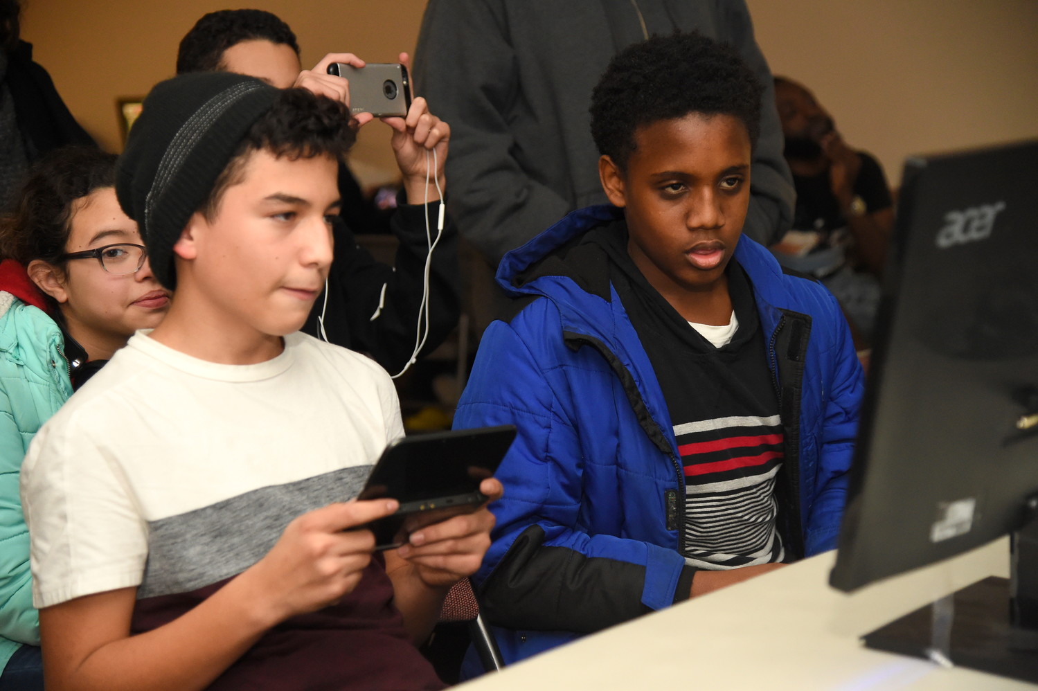 Making their way to the final round, Kenny Hernandez, 14, left and Daven Lewis, 13, right, went head to head during the Smash Freeport video game tournament held at the Freeport Memorial Library on Dec. 15.