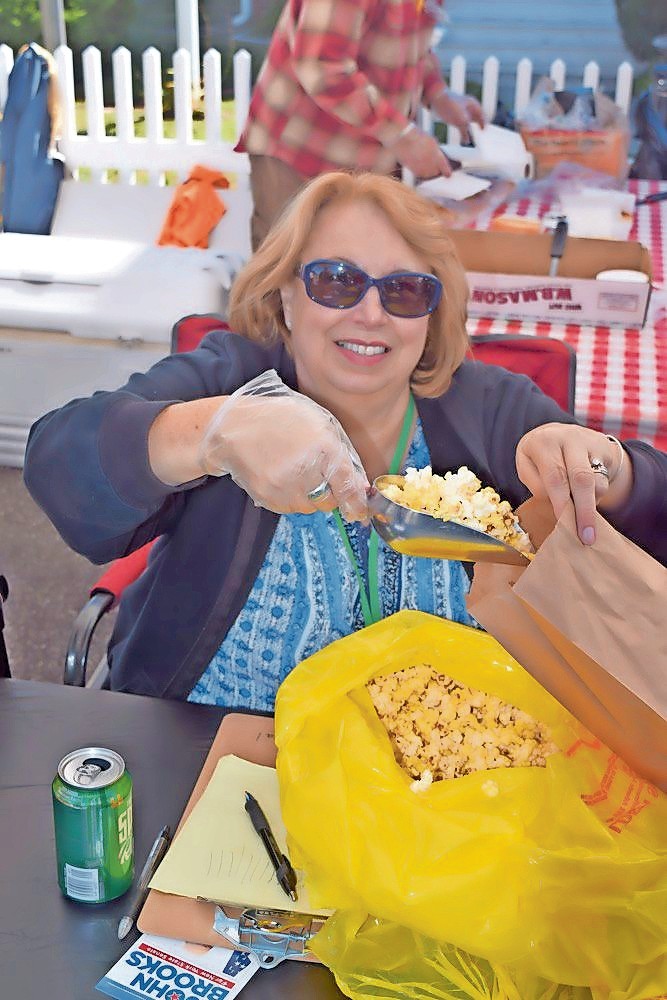 Judy Bongiovi, president of the Seaford Historical Society, is involved with all things Seaford. Last year she handed out popcorn at the organization’s annual Fall Harvest Fair.