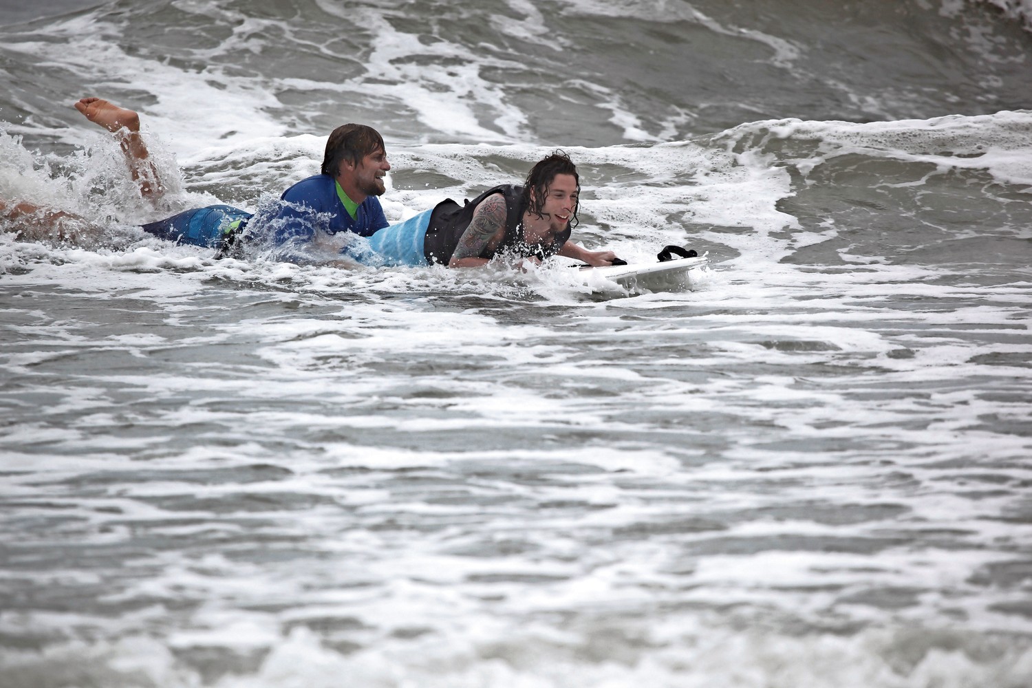 Will Skudin, left, hit the waves with "Surfing Samurai" Dylan Hronec in July during the 8th annual NYSEA Surf Week.