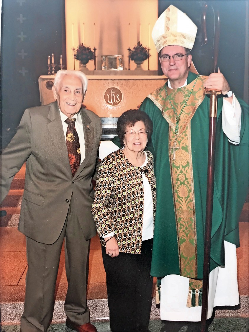 A bishop at St. Rose of Lima Catholic Church in Massapequa blessed couples married for more than 50 years, including the Luccas.
