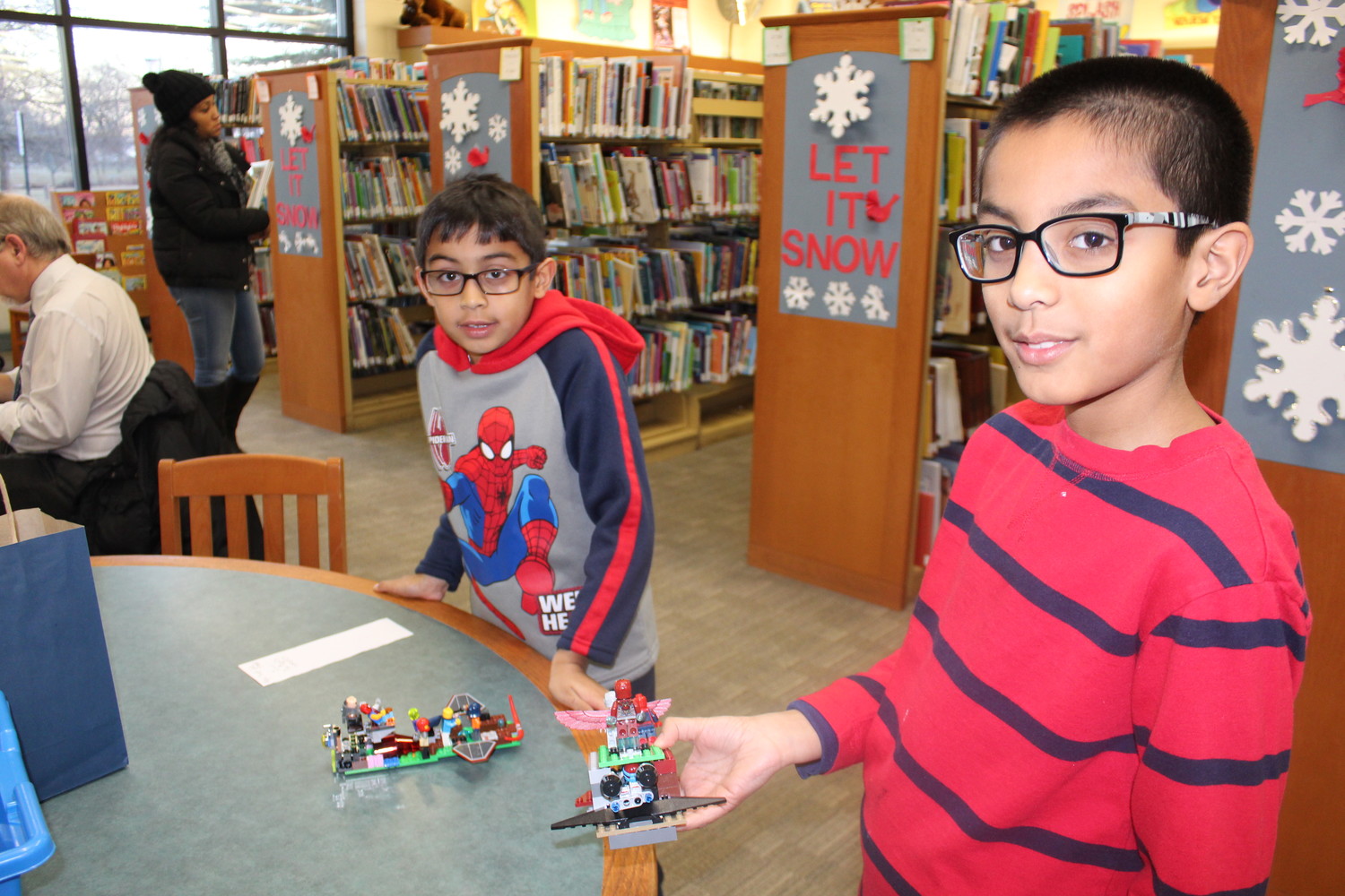 Rajiv and Sanjeev Singh made battleships out of LEGOs for the Henry Waldinger Memorial Library’s 21st Annual Children’s LEGO Exhibit.