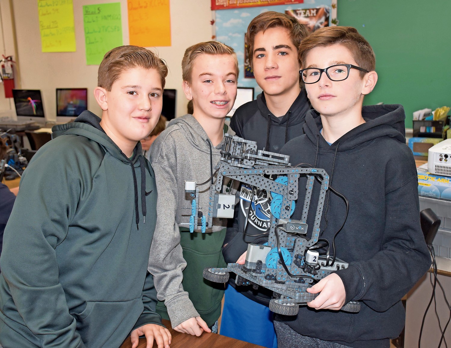 Seaford Middle School eighth-graders, from left, Jimmy Manzick, Paul Anzelone, Evan Paccione and Brandon Owens learned about robotics in a new half-year technology course.