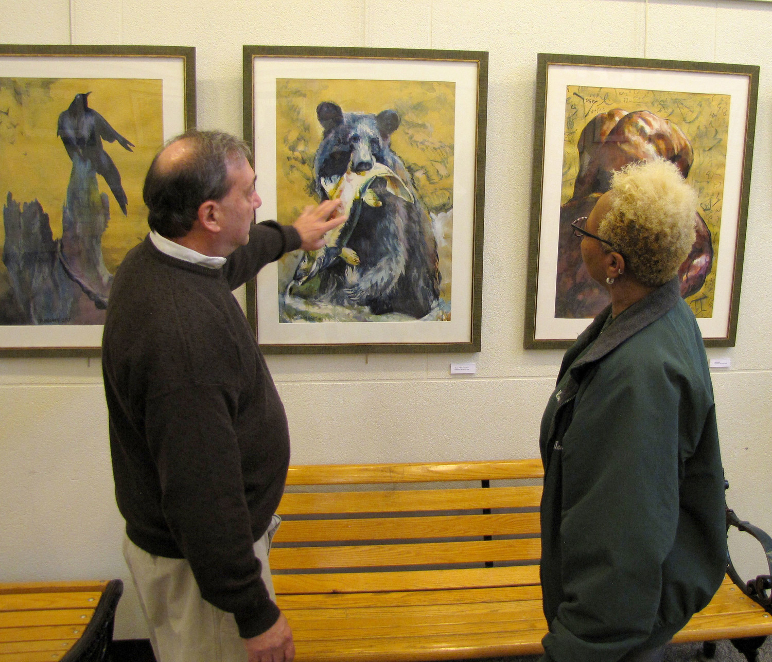 Marc Josloff, left, talked about his paintings with Freeporter, Peggy Bickett at the Freeport Memorial Library on Jan. 8.