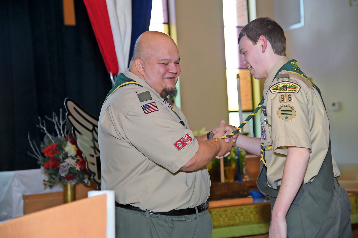 Parola thanked Troop 96 Assistant Scoutmaster Anthony Fillizola, left, after Fillizola spoke of Parola’s journey to Eagle Scout.
