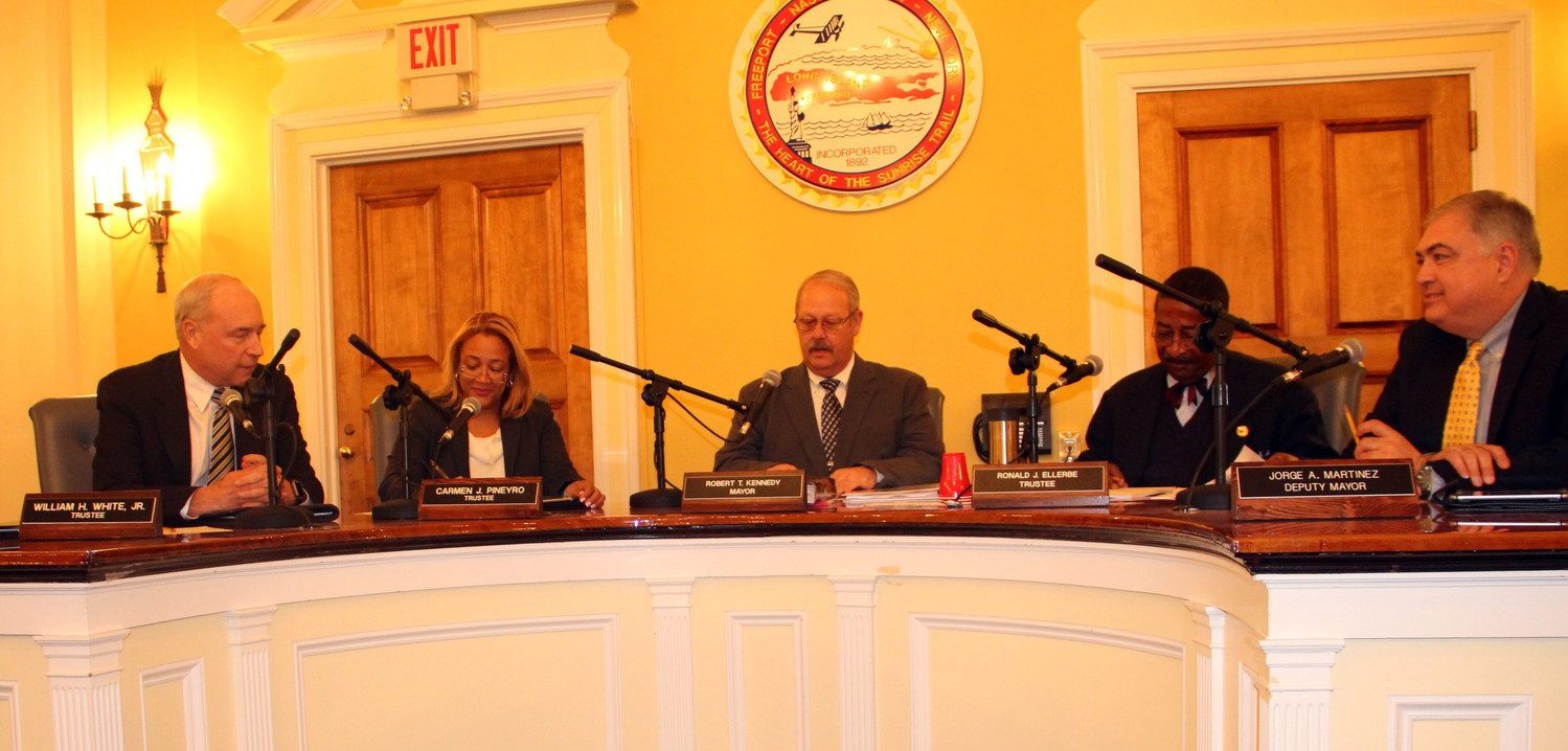 The village board of trustees welcomed a former colleague, Bill White Jr. to his first board meeting after he was sworn in as trustee on Jan. 22. From left, were White, Carmen Pineyro, Mayor Robert Kennedy, Ron Ellerbee, and Deputy MayorJorge Martinez.