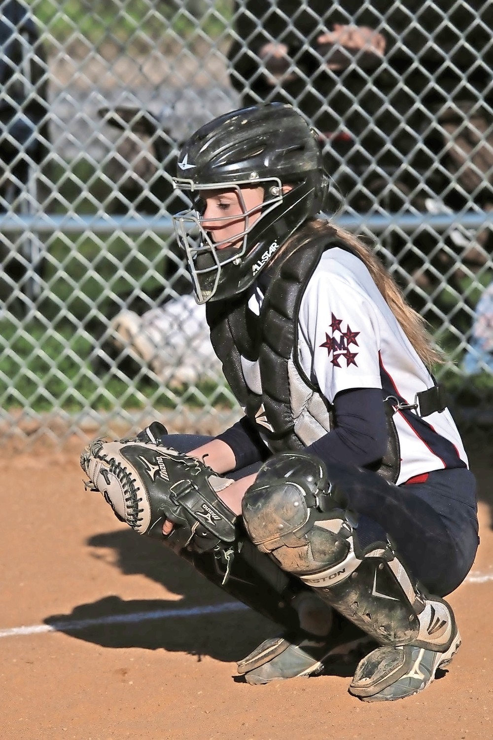 Ashley Budrewicz, Jessica’s twin and battery-mate, behind the plate.