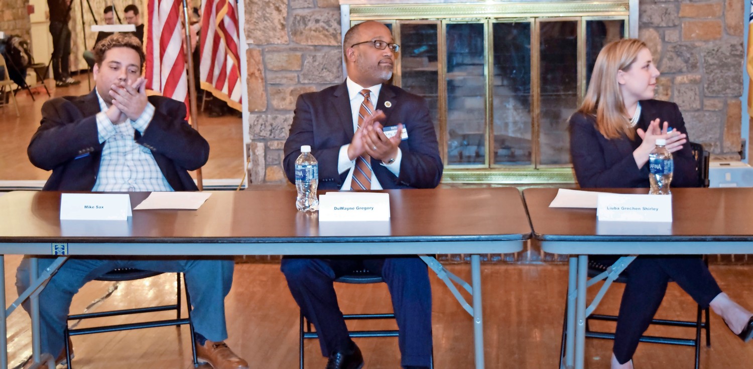 A debate among Mike Sax, far left, DuWayne Gregory and Liuba Grechen Shirley, all running to unseat Peter King in the 2nd Congressional District, heated up at a Democratic candidates’ forum in Merrick on Jan. 25.